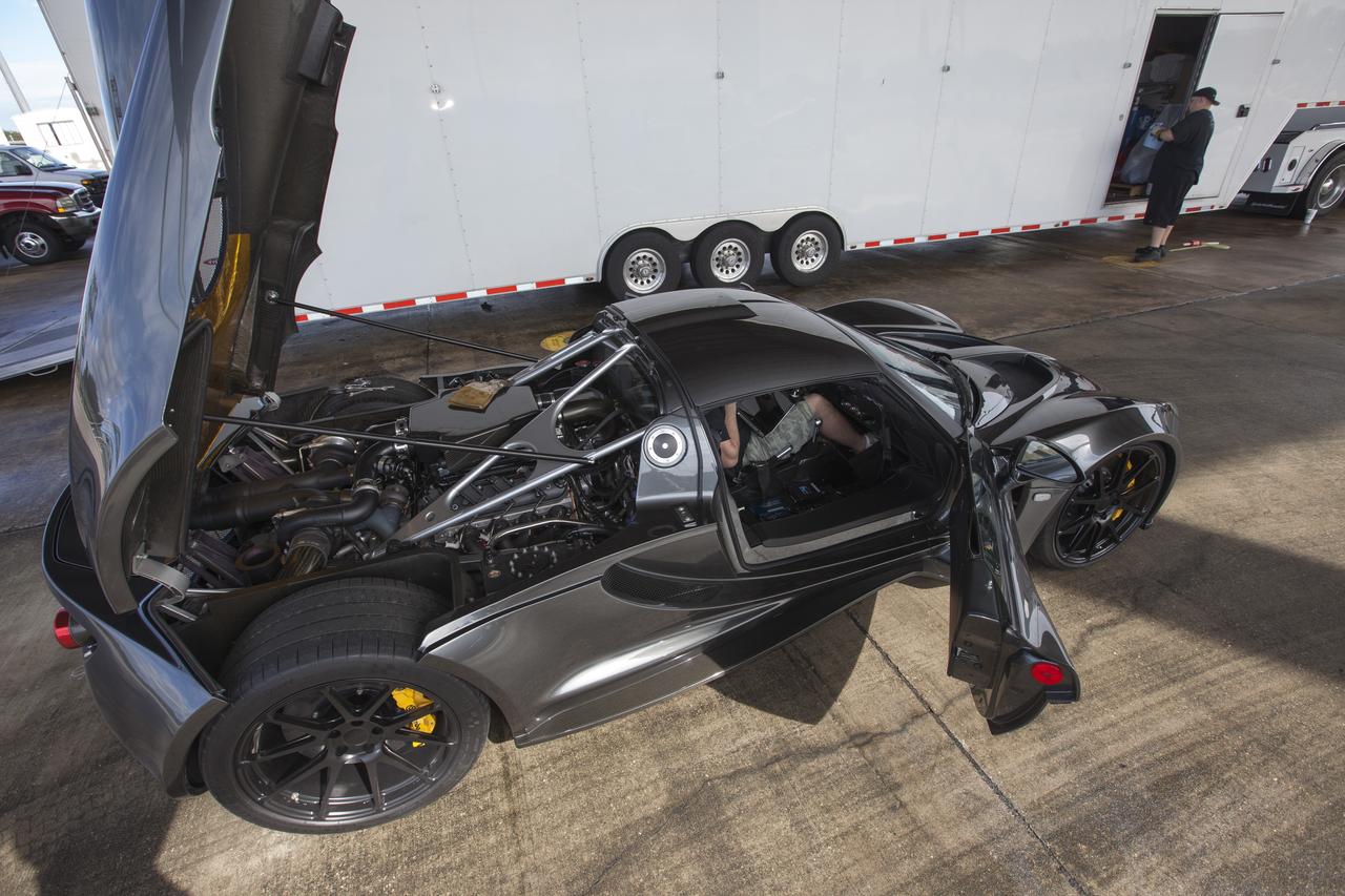 CAPE CANAVERAL, Fla. - An engineer readies a Hennessey Venom GT for test runs on the 3.5-mile long runway at the Shuttle Landing Facility at NASA's Kennedy Space Center in Florida. The flat concrete runway is one of the few places in the world where high performance automobiles can be tested for aerodynamic and safety designs. Hennessey Performance of Sealy, Texas, worked with Performance Power Racing in West Palm Beach to arrange use of the NASA facility. Performance Power Racing has conducted numerous engineering tests on the runway with a variety of vehicles. Photo credit: NASA/Kim Shiflett