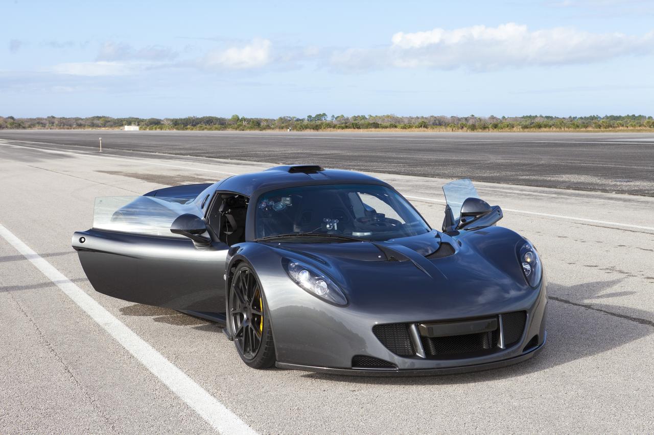 CAPE CANAVERAL, Fla. - A Hennessey Venom GT stands on the 3.5-mile long runway between test runs at the Shuttle Landing Facility at NASA's Kennedy Space Center in Florida. The flat concrete runway is one of the few places in the world where high performance automobiles can be tested for aerodynamic and safety designs. Hennessey Performance of Sealy, Texas, worked with Performance Power Racing in West Palm Beach to arrange use of the NASA facility. Performance Power Racing has conducted numerous engineering tests on the runway with a variety of vehicles. Photo credit: NASA/Kim Shiflett 