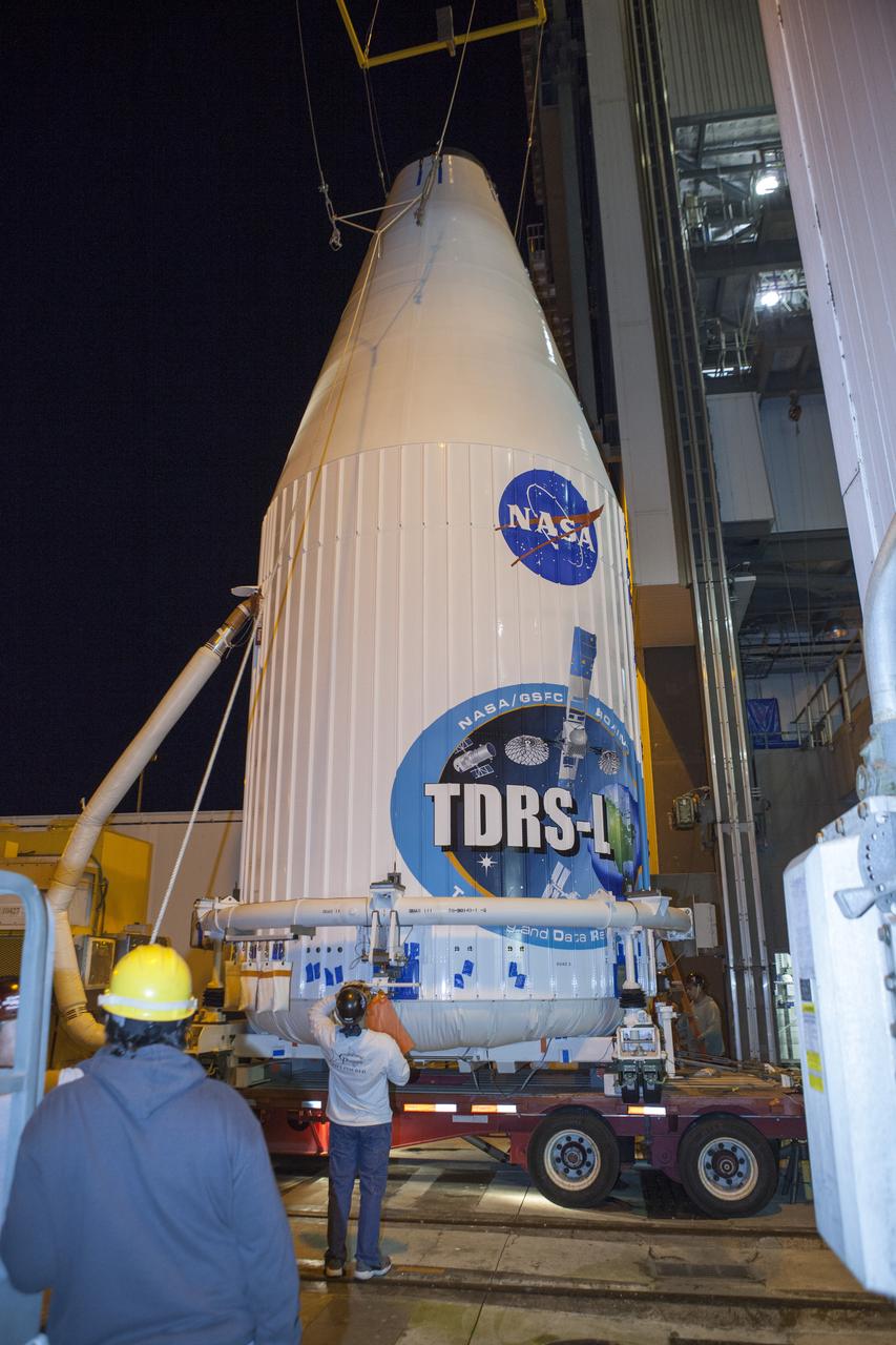 CAPE CANAVERAL, Fla. – At Cape Canaveral Air Force Station's Vertical Integration Facility at Launch Complex 41, engineers and technicians prepare to lift NASA's Tracking and Data Relay Satellite, or TDRS-L, spacecraft for mounting atop a United Launch Alliance Atlas V rocket. The TDRS-L satellite will be a part of the second of three next-generation spacecraft designed to ensure vital operational continuity for the NASA Space Network. It is scheduled to launch from Cape Canaveral's Space Launch Complex 41 atop a United Launch Alliance Atlas V rocket on Jan. 23, 2014. The current Tracking and Data Relay Satellite system consists of eight in-orbit satellites distributed to provide near continuous information relay contact with orbiting spacecraft ranging from the International Space Station and Hubble Space Telescope to the array of scientific observatories. For more information, visit: http://www.nasa.gov/mission_pages/tdrs/home/index.html Photo credit: NASA/Dimitri Gerondidakis