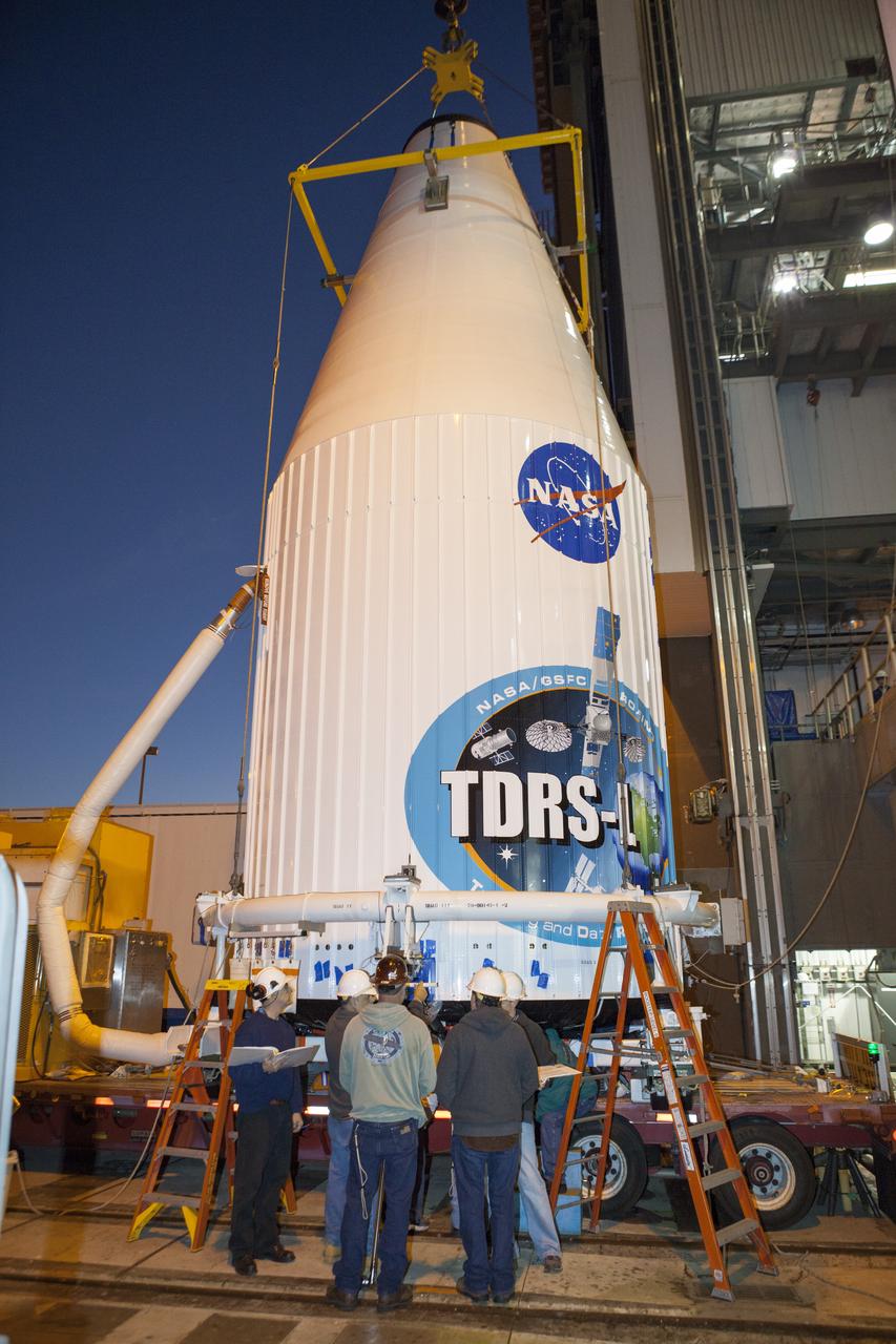 CAPE CANAVERAL, Fla. – At Cape Canaveral Air Force Station's Vertical Integration Facility at Launch Complex 41, engineers and technicians prepare to lift NASA's Tracking and Data Relay Satellite, or TDRS-L, spacecraft for mounting atop a United Launch Alliance Atlas V rocket. The TDRS-L satellite will be a part of the second of three next-generation spacecraft designed to ensure vital operational continuity for the NASA Space Network. It is scheduled to launch from Cape Canaveral's Space Launch Complex 41 atop a United Launch Alliance Atlas V rocket on Jan. 23, 2014. The current Tracking and Data Relay Satellite system consists of eight in-orbit satellites distributed to provide near continuous information relay contact with orbiting spacecraft ranging from the International Space Station and Hubble Space Telescope to the array of scientific observatories. For more information, visit: http://www.nasa.gov/mission_pages/tdrs/home/index.html Photo credit: NASA/Dimitri Gerondidakis
