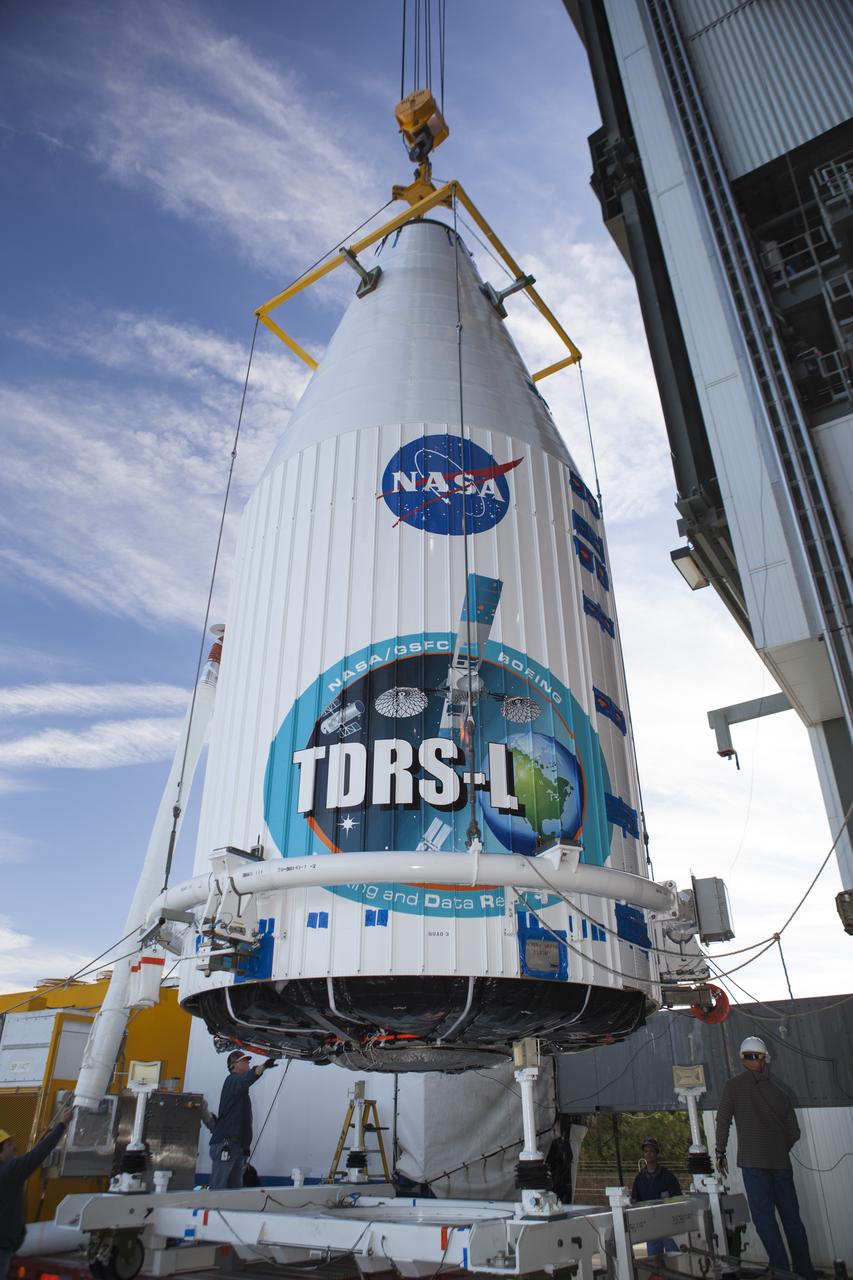 CAPE CANAVERAL, Fla. – At Cape Canaveral Air Force Station's Vertical Integration Facility at Launch Complex 41, engineers and technicians begin lifting NASA's Tracking and Data Relay Satellite, or TDRS-L, spacecraft for mounting atop a United Launch Alliance Atlas V rocket. The TDRS-L satellite will be a part of the second of three next-generation spacecraft designed to ensure vital operational continuity for the NASA Space Network. It is scheduled to launch from Cape Canaveral's Space Launch Complex 41 atop a United Launch Alliance Atlas V rocket on Jan. 23, 2014. The current Tracking and Data Relay Satellite system consists of eight in-orbit satellites distributed to provide near continuous information relay contact with orbiting spacecraft ranging from the International Space Station and Hubble Space Telescope to the array of scientific observatories. For more information, visit: http://www.nasa.gov/mission_pages/tdrs/home/index.html Photo credit: NASA/Dimitri Gerondidakis  