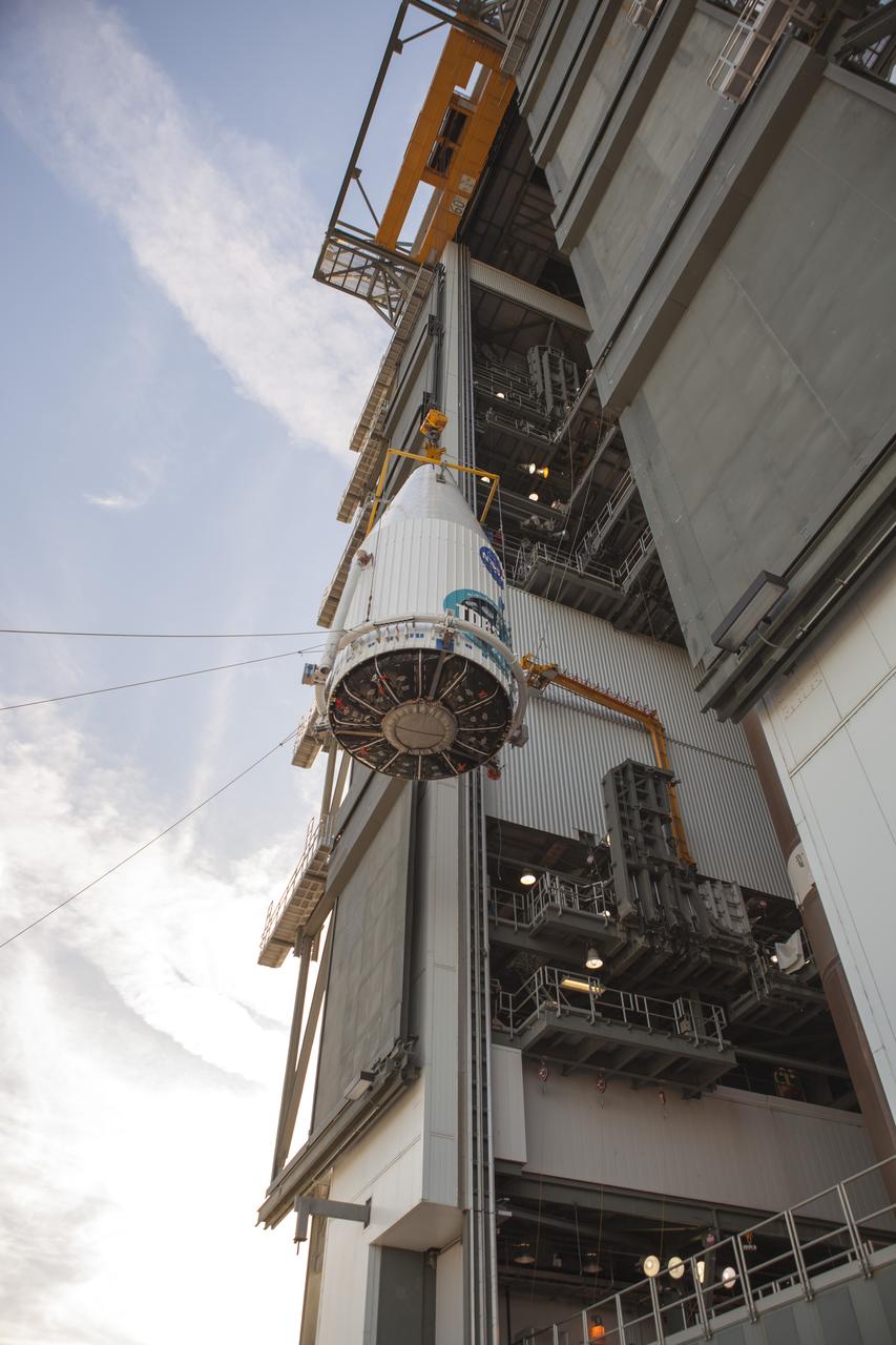CAPE CANAVERAL, Fla. – At Cape Canaveral Air Force Station's Vertical Integration Facility at Launch Complex 41, NASA's Tracking and Data Relay Satellite, or TDRS-L, spacecraft is lifted for mounting atop a United Launch Alliance Atlas V rocket. The TDRS-L satellite will be a part of the second of three next-generation spacecraft designed to ensure vital operational continuity for the NASA Space Network. It is scheduled to launch from Cape Canaveral's Space Launch Complex 41 atop a United Launch Alliance Atlas V rocket on Jan. 23, 2014. The current Tracking and Data Relay Satellite system consists of eight in-orbit satellites distributed to provide near continuous information relay contact with orbiting spacecraft ranging from the International Space Station and Hubble Space Telescope to the array of scientific observatories. For more information, visit: http://www.nasa.gov/mission_pages/tdrs/home/index.html Photo credit: NASA/Dimitri Gerondidakis