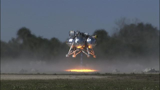 CAPE CANAVERAL, Fla. – The Project Morpheus prototype lander begins its ascent from a launch pad during the third free flight test at the north end of the Shuttle Landing Facility at NASA’s Kennedy Space Center in Florida. The 57-second test began at 1:15 p.m. EST with the Morpheus lander launching from the ground over a flame trench and ascending about 187 feet, nearly doubling the target ascent velocity from the last test in December 2013. The lander flew forward, covering about 154 feet in 20 seconds before descending and landing within 11 inches of its target on a dedicated pad inside the autonomous landing and hazard avoidance technology, or ALHAT, hazard field. Project Morpheus tests NASA’s ALHAT and an engine that runs on liquid oxygen and methane, or green propellants, into a fully-operational lander that could deliver cargo to other planetary surfaces. The landing facility provides the lander with the kind of field necessary for realistic testing, complete with rocks, craters and hazards to avoid. Morpheus’ ALHAT payload allows it to navigate to clear landing sites amidst rocks, craters and other hazards during its descent. Project Morpheus is being managed under the Advanced Exploration Systems, or AES, Division in NASA’s Human Exploration and Operations Mission Directorate. The efforts in AES pioneer new approaches for rapidly developing prototype systems, demonstrating key capabilities and validating operational concepts for future human missions beyond Earth orbit. For more information on Project Morpheus, visit http://www.nasa.gov/centers/johnson/exploration/morpheus. Photo credit: NASA/Frankie Martin