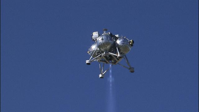 CAPE CANAVERAL, Fla. – The Project Morpheus prototype lander ascends after launching on its third free flight test at the north end of the Shuttle Landing Facility at NASA’s Kennedy Space Center in Florida. The 57-second test began at 1:15 p.m. EST with the Morpheus lander launching from the ground over a flame trench and ascending about 187 feet, nearly doubling the target ascent velocity from the last test in December 2013. The lander flew forward, covering about 154 feet in 20 seconds before descending and landing within 11 inches of its target on a dedicated pad inside the autonomous landing and hazard avoidance technology, or ALHAT, hazard field. Project Morpheus tests NASA’s ALHAT and an engine that runs on liquid oxygen and methane, or green propellants, into a fully-operational lander that could deliver cargo to other planetary surfaces. The landing facility provides the lander with the kind of field necessary for realistic testing, complete with rocks, craters and hazards to avoid. Morpheus’ ALHAT payload allows it to navigate to clear landing sites amidst rocks, craters and other hazards during its descent. Project Morpheus is being managed under the Advanced Exploration Systems, or AES, Division in NASA’s Human Exploration and Operations Mission Directorate. The efforts in AES pioneer new approaches for rapidly developing prototype systems, demonstrating key capabilities and validating operational concepts for future human missions beyond Earth orbit. For more information on Project Morpheus, visit http://www.nasa.gov/centers/johnson/exploration/morpheus. Photo credit: NASA/Frankie Martin