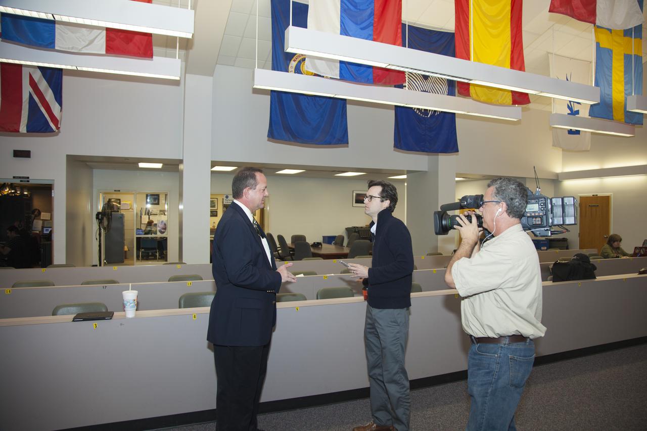 CAPE CANAVERAL, Fla. – Tom Engler, at left, the deputy director of the Center Planning and Development Directorate, or CPDD, at NASA’s Kennedy Space Center in Florida, speaks to reporter James Dean from Florida Today newspaper during an interview at the Kennedy News Center. Kennedy Space Center is working with private industry in new and innovative ways as the agency's premier launch center adapts to changing spaceflight, research and exploration goals in America. Opportunities are rich and varied, ranging from working with the private launch industry, to involvement with NASA's expendable launch vehicles programs to beginning or participating in research in a number of advancing fields. For more information on CPDD, visit http://www.nasa.gov/centers/kennedy/business/index.html. Photo credit: NASA/Daniel Casper