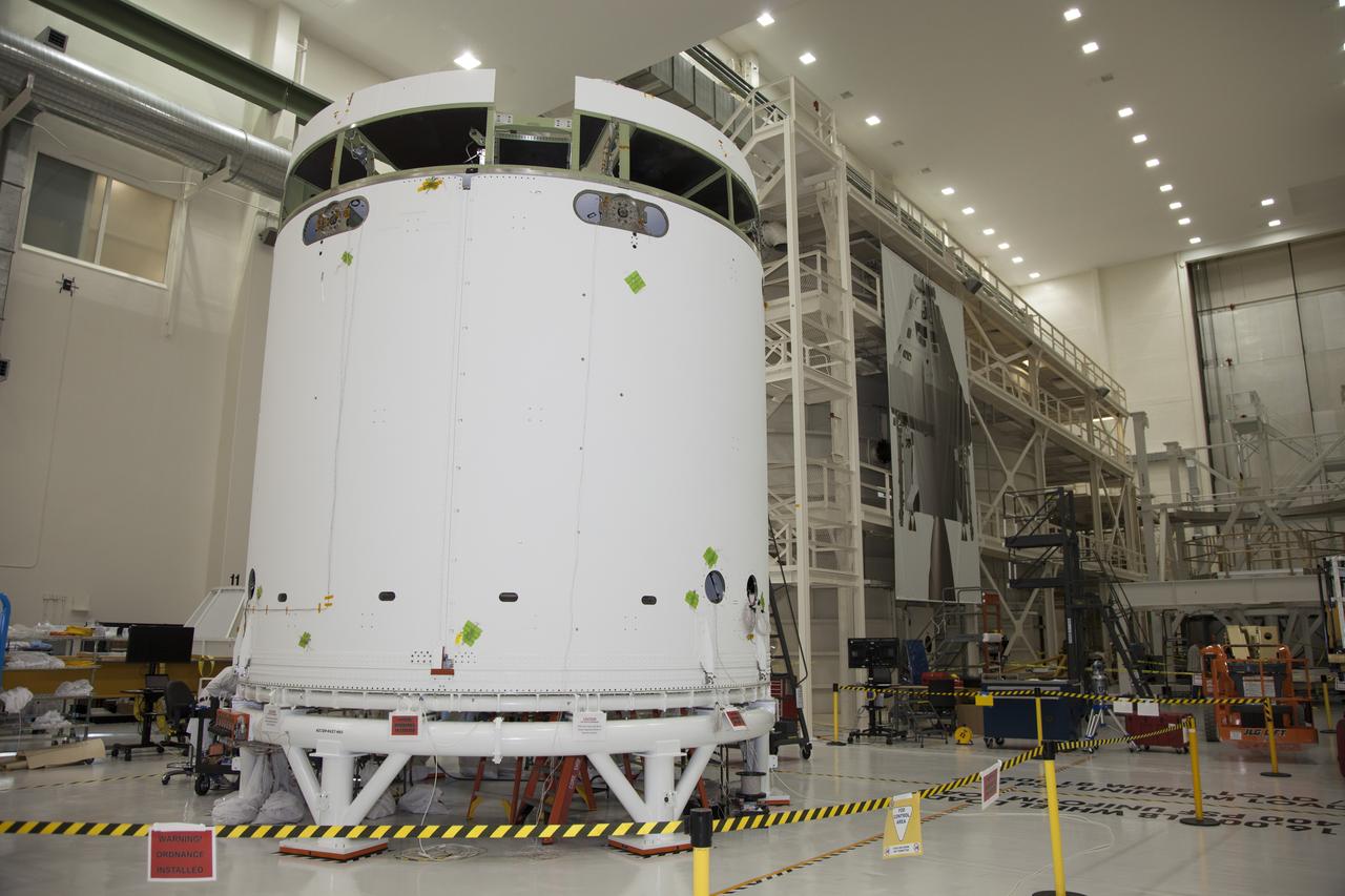 CAPE CANAVERAL, Fla. – Inside the Operations and Checkout Building high bay at NASA’s Kennedy Space Center in Florida, the service module for the Orion spacecraft is secured to a work stand and all three of the fairings have been installed around it. The fairings will protect the service module during launch. The Orion spacecraft is being prepared for its first unpiloted flight test, Exploration Flight Test-1, or EFT-1, scheduled for launch atop a Delta IV rocket in September 2014. The Orion spacecraft is designed to carry astronauts to destinations not yet explored by humans. It will have emergency abort capability, sustain the crew during space travel and provide safe re-entry from deep space return velocities. Orion is scheduled to launch atop NASA’s Space Launch System rocket in 2017. For more information, visit http://www.nasa.gov/orion. Photo credit: NASA/Daniel Casper
