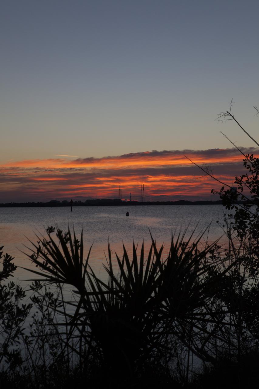 CAPE CANAVERAL, Fla. – At Cape Canaveral Air Force Station's Launch Complex 41, the United Launch Alliance Atlas V with NASA's Tracking and Data Relay Satellite, or TDRS-L, spacecraft atop, is back-dropped by the rising sun looking across the Banana River. The TDRS-L spacecraft is the second of three new satellites designed to ensure vital operational continuity for NASA by expanding the lifespan of the Tracking and Data Relay Satellite System TDRSS fleet, which consists of eight satellites in geosynchronous orbit. The spacecraft provide tracking, telemetry, command and high bandwidth data return services for numerous science and human exploration missions orbiting Earth. These include NASA's Hubble Space Telescope and the International Space Station. TDRS-L has a high-performance solar panel designed for more spacecraft power to meet the growing S-band communications requirements. TDRSS is one of NASA Space Communication and Navigation’s SCaN three networks providing space communications to NASA’s missions. For more information more about TDRS-L, visit: http://www.nasa.gov/tdrs To learn more about SCaN, visit: www.nasa.gov/scan Photo credit: NASA/Ben Smegelsky