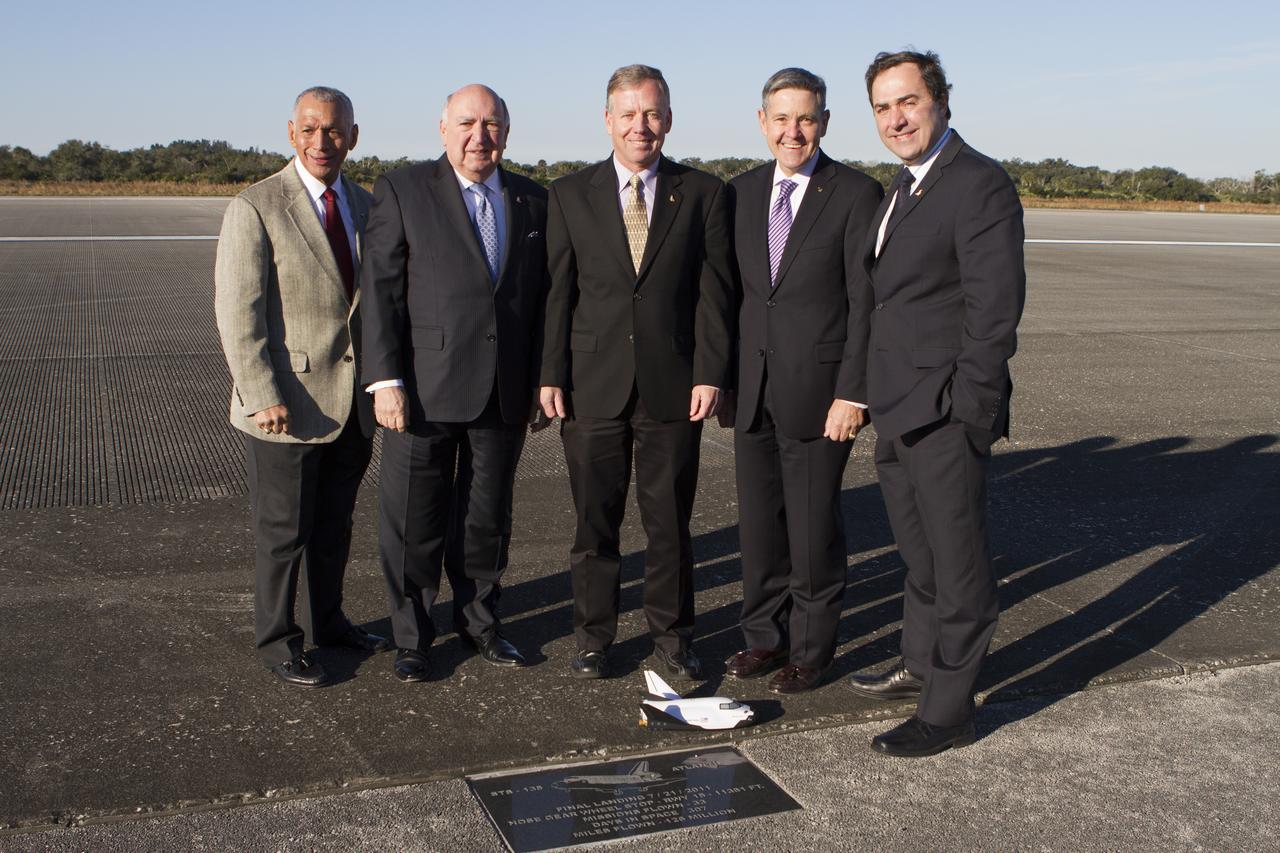 NASA and aerospace industry representatives tour facilities along Florida’s Space Coast prior to announcements made by Sierra Nevada Corporation, or SNC, Space Systems, to prepare for a November 2016 orbital flight of its Dream Chaser spacecraft. Walking along the 3.5-mile-long runway at Kennedy Space Center’s Shuttle Landing Facility are, from left, Frank DiBello, president and CEO of Space Florida Steve Lindsey, Dream Chaser program manager for SNC Space Systems Bob Cabana, director of NASA’s Kennedy Space Center Mark Sirangelo, corporate vice president and head of SNC Space Systems and Charlie Bolden, administrator of NASA. 