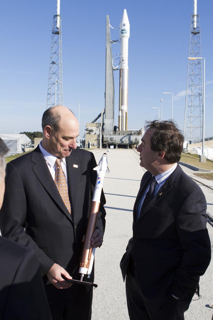 CAPE CANAVERAL, Fla. – Michael Gass, president and CEO of United Launch Alliance, or ULA, left, talks to Mark Sirangelo, corporate vice president and head of Sierra Nevada Corporation, or SNC, Space Systems at Space Launch Complex 41 at Cape Canaveral Air Force Station in Florida. Behind the duo is ULA’s Atlas V rocket, which will carry NASA’s Tracking and Data Relay Satellite-L, or TDRS-L, into orbit. SNC announced it plans to work with ULA to launch the Dream Chaser spacecraft into orbit in November 2016 intends to land the winged spacecraft at the 3.5-mile-long runway at Kennedy Space Center’s Shuttle Landing Facility lease office space at Exploration Park, right outside Kennedy’s gates and process the spacecraft in the high bay of the Operations and Checkout Building at Kennedy, with Lockheed Martin performing the work. The announcements made during a news conference at Kennedy are considered substantial for SNC and important to plans by NASA and Space Florida for Kennedy’s transformation into a multi-user spaceport for both commercial and government customers. Photo credit: NASA/Cory Huston