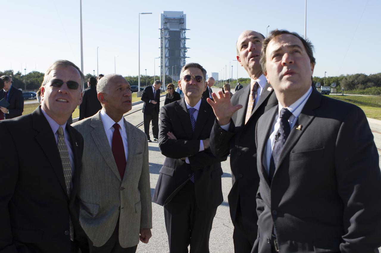 CAPE CANAVERAL, Fla. – NASA and aerospace industry representatives tour facilities along Florida’s Space Coast prior to announcements made by Sierra Nevada Corporation, or SNC, Space Systems, to prepare for a November 2016 orbital flight of its Dream Chaser spacecraft. Standing at the base of Space Launch Complex 41 at Cape Canaveral Air Force Station in Florida, from left, are Steve Lindsey, Dream Chaser program manager for SNC Space Systems Charlie Bolden, administrator of NASA Bob Cabana, director of NASA’s Kennedy Space Center Michael Gass, president and CEO of United Launch Alliance, or ULA and Mark Sirangelo, corporate vice president and head of SNC Space Systems. SNC announced it plans to work with ULA to launch the Dream Chaser spacecraft into orbit atop an Atlas V rocket from Space Launch Complex 41 at Cape Canaveral Air Force Station intends to land the winged spacecraft at the 3.5-mile-long runway at Kennedy’s Shuttle Landing Facility lease office space at Exploration Park, right outside Kennedy’s gates and process the spacecraft in the high bay of the Operations and Checkout Building at Kennedy, with Lockheed Martin performing the work. The announcements made during a news conference at Kennedy are considered substantial for SNC and important to plans by NASA and Space Florida for Kennedy’s transformation into a multi-user spaceport for both commercial and government customers. Photo credit: NASA/Cory Huston
