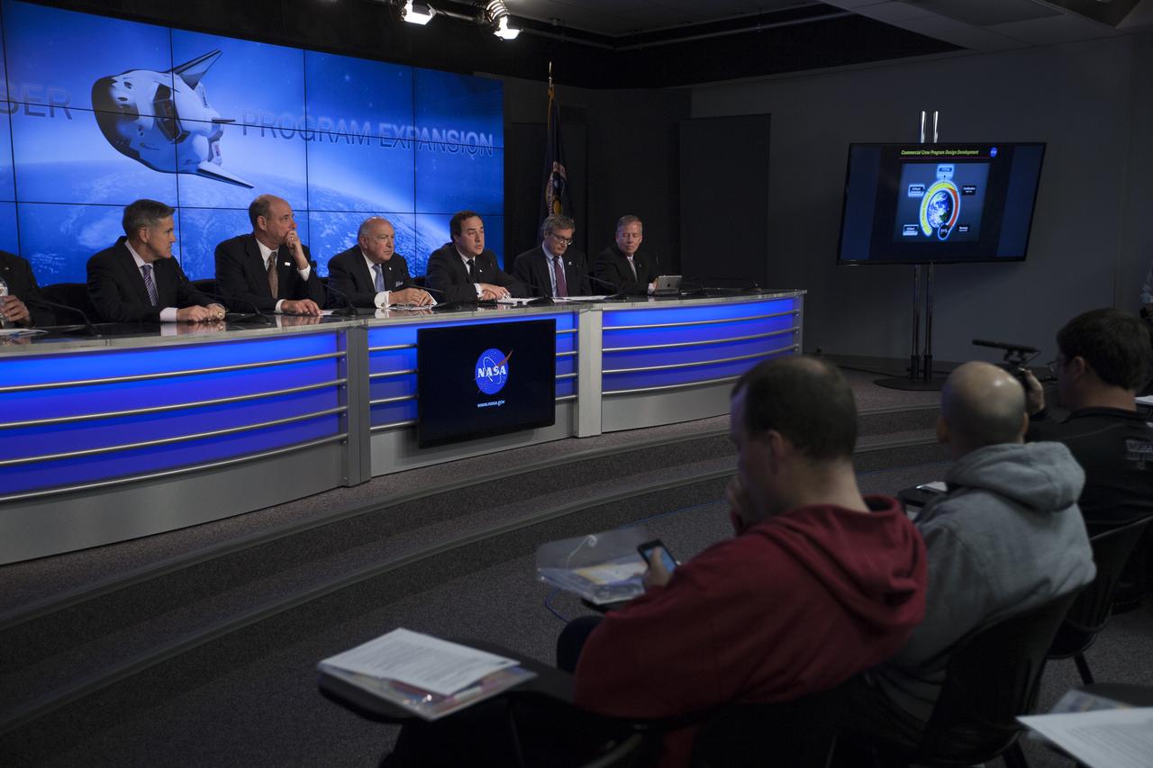 CAPE CANAVERAL, Fla. – Sierra Nevada Corporation, or SNC, Space Systems, announces the steps the company will take to prepare for a November 2016 orbital flight of its Dream Chaser spacecraft from Florida’s Space Coast during a news conference at NASA’s Kennedy Space Center in Florida. Participants, from left, are Bob Cabana, director of Kennedy Michael Gass, president and CEO of United Launch Alliance, or ULA Frank DiBello, president and CEO of Space Florida Mark Sirangelo, corporate vice president and head of SNC Space Systems Larry Price, Lockheed Martin Space Systems deputy program manager for NASA's Orion spacecraft and Steve Lindsey, Dream Chaser program manager for SNC Space Systems. The steps are considered substantial for SNC and important to plans by NASA and Space Florida for Kennedy’s transformation into a multi-user spaceport for both commercial and government customers. SNC said it plans to work with ULA to launch the Dream Chaser spacecraft into orbit atop an Atlas V rocket from Space Launch Complex 41 at Cape Canaveral Air Force Station intends to land the winged spacecraft at Kennedy’s 3.5-mile long runway at the Shuttle Landing Facility lease office space at Exploration Park, right outside Kennedy’s gates and process the spacecraft in the high bay of the Operations and Checkout Building at Kennedy, with Lockheed Martin performing the work. Photo credit: NASA/Kim Shiflett