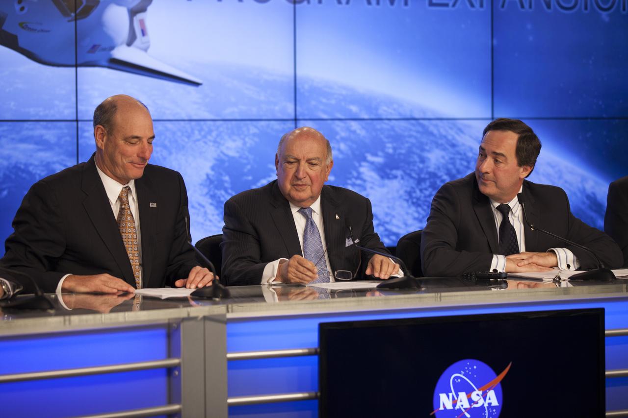 CAPE CANAVERAL, Fla. – Frank DiBello, president and CEO of Space Florida, joins Sierra Nevada Corporation, or SNC, Space Systems, as the company announces the steps it will take to prepare for a November 2016 orbital flight of its Dream Chaser spacecraft from Florida’s Space Coast. The steps are considered substantial for SNC and important to plans by NASA and Space Florida for Kennedy Space Center’s transformation into a multi-user spaceport for both commercial and government customers. SNC said it plans to work with United Launch Alliance, or ULA, to launch the Dream Chaser spacecraft into orbit atop an Atlas V rocket from Space Launch Complex 41 at Cape Canaveral Air Force Station intends to land the winged spacecraft at Kennedy’s 3.5-mile long runway at the Shuttle Landing Facility lease office space at Exploration Park, right outside Kennedy’s gates and process the spacecraft in the high bay of the Operations and Checkout Building at Kennedy, with Lockheed Martin performing the work. Photo credit: NASA/Kim Shiflett
