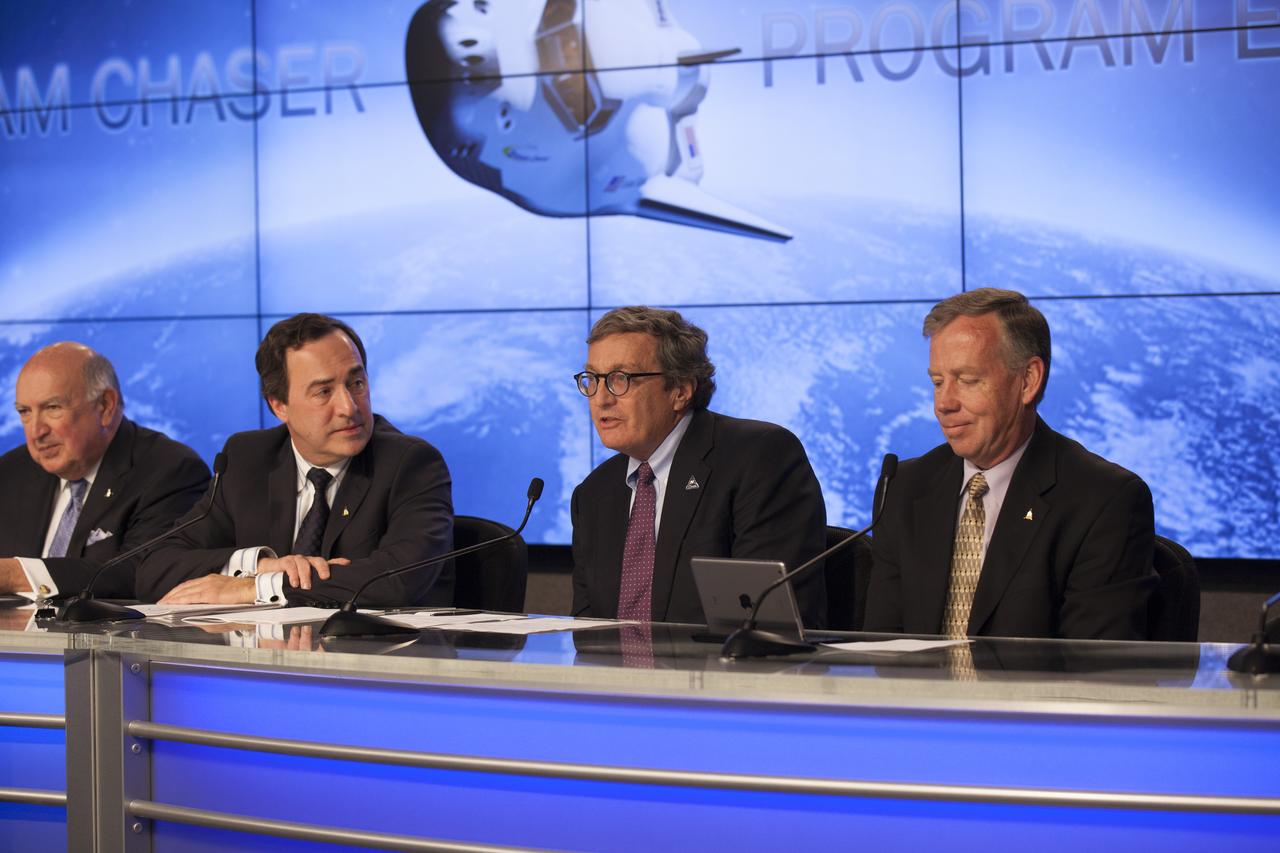 CAPE CANAVERAL, Fla. – Larry Price, Lockheed Martin Space Systems deputy program manager for NASA's Orion spacecraft, joins Sierra Nevada Corporation, or SNC, Space Systems, as the company announces the steps it will take to prepare for a November 2016 orbital flight of its Dream Chaser spacecraft from Florida’s Space Coast. The steps are considered substantial for SNC and important to plans by NASA and Space Florida for Kennedy Space Center’s transformation into a multi-user spaceport for both commercial and government customers. SNC said it plans to work with United Launch Alliance, or ULA, to launch the Dream Chaser spacecraft into orbit atop an Atlas V rocket from Space Launch Complex 41 at Cape Canaveral Air Force Station intends to land the winged spacecraft at Kennedy’s 3.5-mile long runway at the Shuttle Landing Facility lease office space at Exploration Park, right outside Kennedy’s gates and process the spacecraft in the high bay of the Operations and Checkout Building at Kennedy, with Lockheed Martin performing the work. Photo credit: NASA/Kim Shiflett