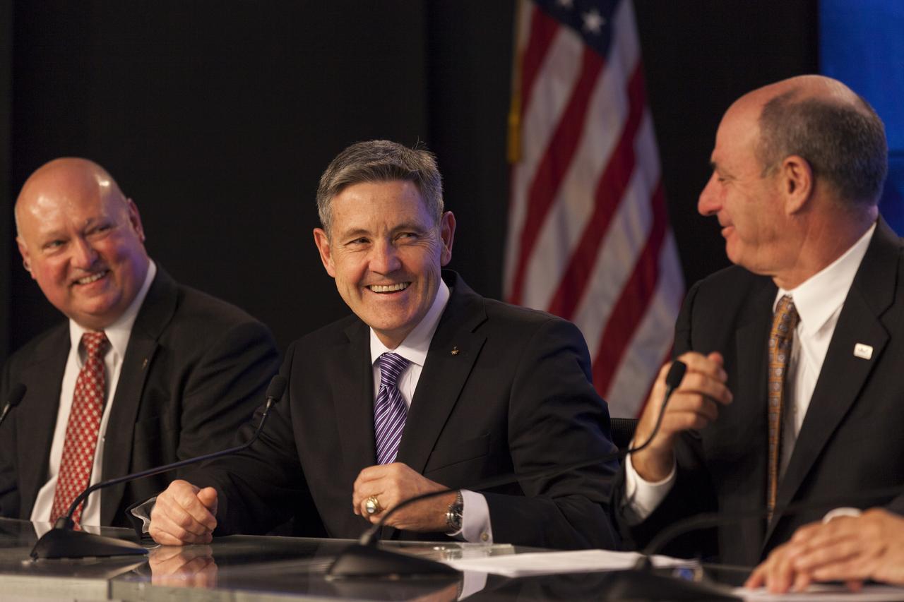 CAPE CANAVERAL, Fla. – Bob Cabana, center, director of Kennedy Space Center in Florida, joins Sierra Nevada Corporation, or SNC, Space Systems, as the company announces the steps it will take to prepare for a November 2016 orbital flight of its Dream Chaser spacecraft from Florida’s Space Coast. The steps are considered substantial for SNC and important to plans by NASA and Space Florida for Kennedy’s transformation into a multi-user spaceport for both commercial and government customers. SNC said it plans to work with United Launch Alliance, or ULA, to launch the Dream Chaser spacecraft into orbit atop an Atlas V rocket from Space Launch Complex 41 at Cape Canaveral Air Force Station intends to land the winged spacecraft at Kennedy’s 3.5-mile long runway at the Shuttle Landing Facility lease office space at Exploration Park, right outside Kennedy’s gates and process the spacecraft in the high bay of the Operations and Checkout Building at Kennedy, with Lockheed Martin performing the work. Photo credit: NASA/Kim Shiflett