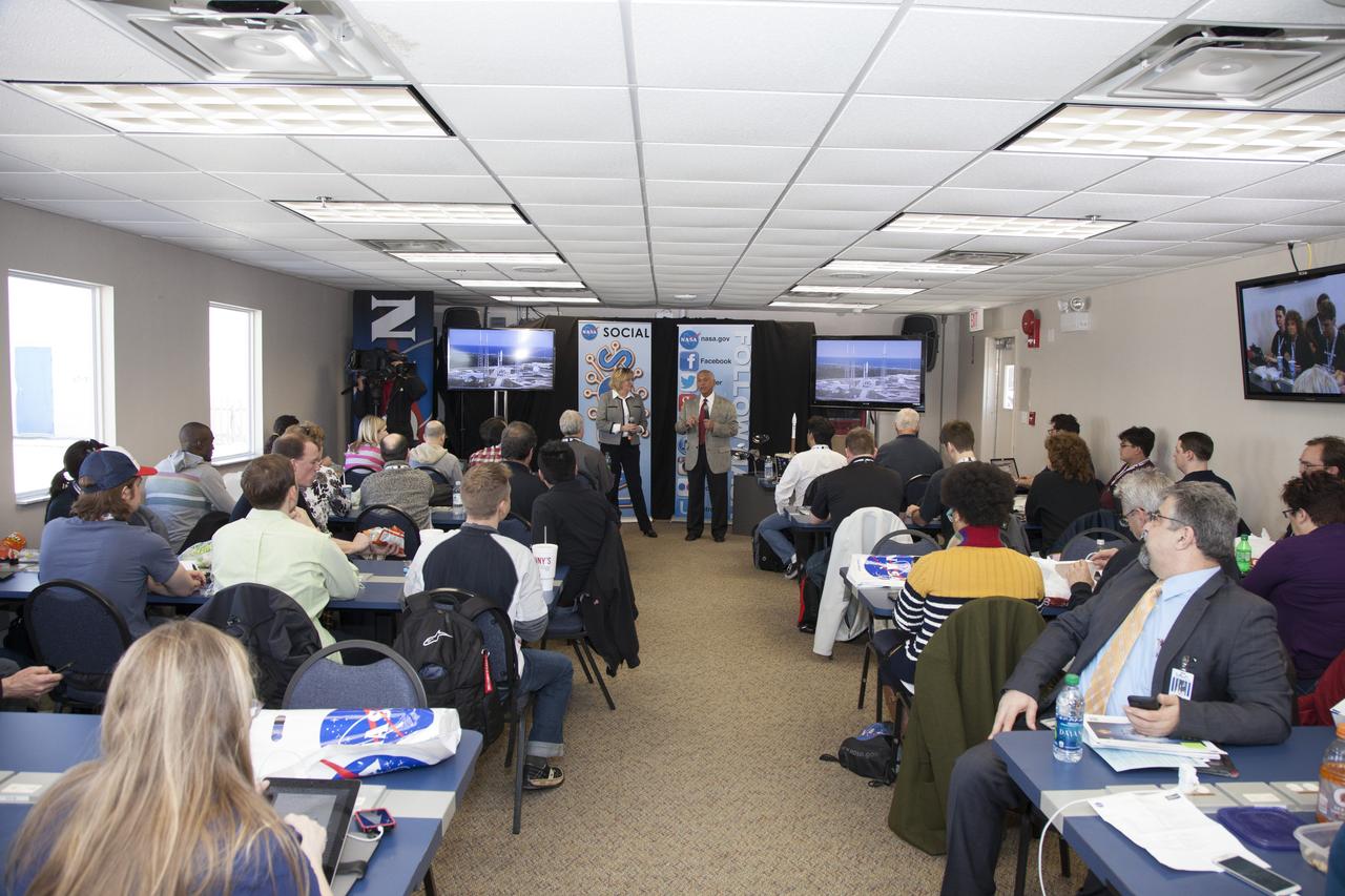 CAPE CANAVERAL, Fla. -- In the NASA News Center annex at NASA's Kennedy Space Center in Florida, social media participants listen to a briefing by Acting Administrator of the U.S. Small Business Administration Jeanne Holit, left, and NASA Administrator Charles Bolden. The social media participants gathered at the Florida spaceport for the launch of the Tracking and Data Relay Satellite, or TDRS-L spacecraft. Their visit included tours of key facilities and participating in presentations by key NASA leaders who updated the space agency's current efforts. Photo credit: NASA/Dan Casper