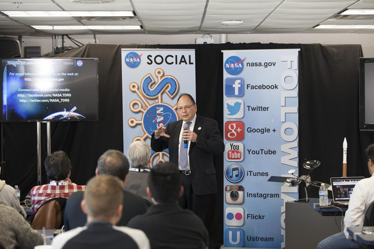 CAPE CANAVERAL, Fla. -- In the NASA News Center annex at NASA's Kennedy Space Center in Florida, social media participants listen to a briefing by Marco Toral, deputy program manager for the Tracking and Data Relay Satellite Program at the agency's Goddard Space Flight Center in Maryland. The social media participants gathered at the Florida spaceport for the launch of the Tracking and Data Relay Satellite, or TDRS-L spacecraft. Their visit included tours of key facilities and participating in presentations by key NASA leaders who updated the space agency's current efforts. Photo credit: NASA/Dan Casper
