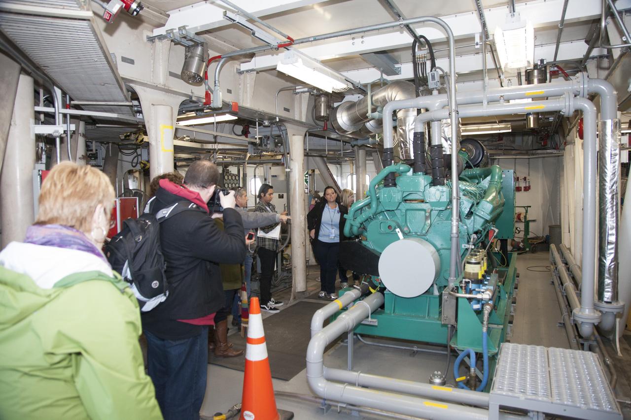 CAPE CANAVERAL, Fla. -- At NASA's Kennedy Space Center in Florida, social media participants were given an up-close look at the interior of one of the spaceport's mammoth crawler-transporters. Recent work has included preparations to install upgraded components that will enable the crawler to carry the greater loads anticipated with the agency's new rocket designed to take astronauts beyond low-Earth orbit for the first time since the early 1970s. The social media participants gathered at the Florida spaceport for the launch of the Tracking and Data Relay Satellite, or TDRS-L spacecraft. Their visit included tours of key facilities and participating in presentations by key NASA leaders who updated the space agency's current efforts. Photo credit: NASA/Dan Casper
