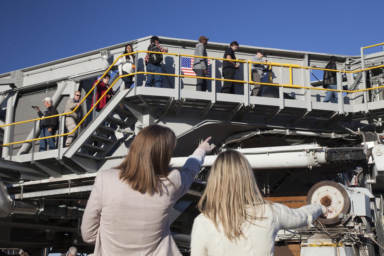 CAPE CANAVERAL, Fla. -- At NASA's Kennedy Space Center in Florida, social media participants were given an up-close look at one of the spaceport's mammoth crawler-transporters. Recent work has included preparations to install upgraded components that will enable the crawler to carry the greater loads anticipated with the agency's new rocket designed to take astronauts beyond low-Earth orbit for the first time since the early 1970s. The social media participants gathered at the Florida spaceport for the launch of the Tracking and Data Relay Satellite, or TDRS-L spacecraft. Their visit included tours of key facilities and participating in presentations by key NASA leaders who updated the space agency's current efforts. Photo credit: NASA/Dan Casper