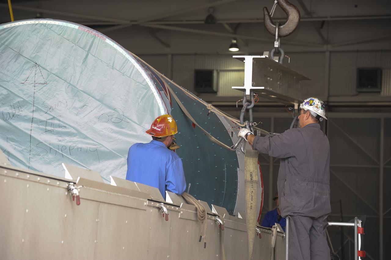 VANDENBERG AIR FORCE BASE, Calif. – Workers attach the interstage adapter, or ISA, for NASA's Orbiting Carbon Observatory-2 mission, or OCO-2, to a lifting device in the high bay of the Building 836 hangar on Vandenberg Air Force Base in California. OCO-2 is scheduled to launch aboard a United Launch Alliance Delta II rocket from Space Launch Complex 2 in July. The ISA is the interface between the Delta II first and second stages. The second stage engine fits within the ISA. OCO-2 will collect precise global measurements of carbon dioxide in the Earth's atmosphere and provide scientists with a better idea of the chemical compound's impacts on climate change. Scientists will analyze this data to improve our understanding of the natural processes and human activities that regulate the abundance and distribution of this important atmospheric gas. To learn more about OCO-2, visit http://oco.jpl.nasa.gov. Photo credit: NASA/Jeremy Moore, 30th Space Wing, VAFB  