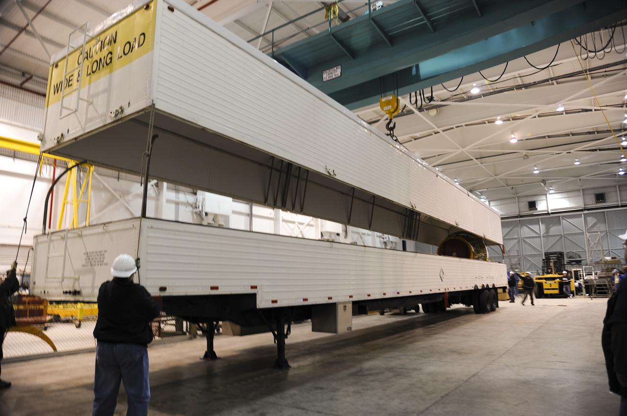 VANDENBERG AIR FORCE BASE, Calif. – As the cover of the transportation trailer is lifted in the high bay of the Building 836 hangar on Vandenberg Air Force Base in California, the second stage for NASA's Orbiting Carbon Observatory-2 mission, or OCO-2, comes into view. OCO-2 is scheduled to launch aboard a United Launch Alliance Delta II rocket from Space Launch Complex 2 in July. The rocket's second stage will insert OCO-2 into a polar Earth orbit. OCO-2 will collect precise global measurements of carbon dioxide in the Earth's atmosphere and provide scientists with a better idea of the chemical compound's impacts on climate change. Scientists will analyze this data to improve our understanding of the natural processes and human activities that regulate the abundance and distribution of this important atmospheric gas. To learn more about OCO-2, visit http://oco.jpl.nasa.gov. Photo credit: NASA/Arron Tauman, 30th Space Wing, VAFB