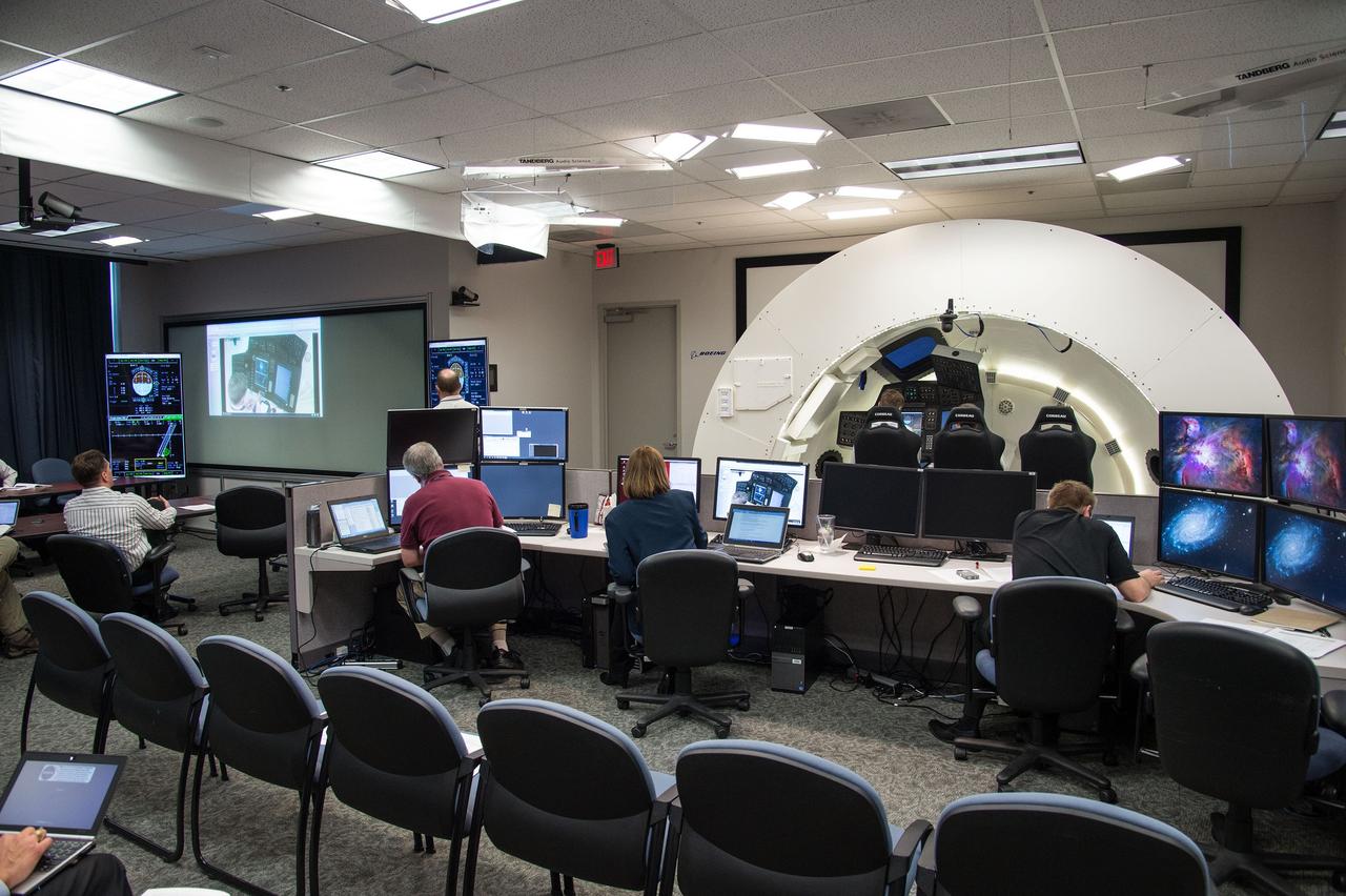 HOUSTON – Engineers for Boeing Space Exploration demonstrate that the CST-100 software allows a human pilot to take over control of the spacecraft from the computer during all phases of a mission following separation from the launch vehicle. The pilot-in-the-loop demonstration at the Houston Product Support Center is a milestone under Boeing's Commercial Crew Integrated Capability agreement with the agency and its Commercial Crew Program. Photo credit: NASA/Bill Stafford