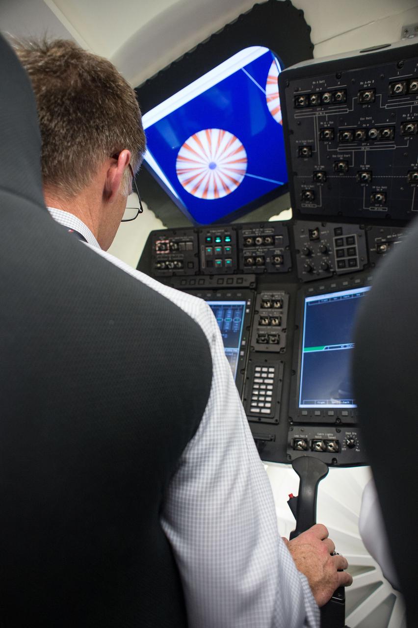 HOUSTON – Chris Ferguson, a former space shuttle commander who is now director of Crew and Mission Operations for Boeing Space Exploration, sits at the controls in the inside the company's CST-100 spacecraft simulator. Boeing demonstrated that the CST-100 software allows a human pilot to take over control of the spacecraft from the computer during all phases of a mission following separation from the launch vehicle. The pilot-in-the-loop demonstration at the Houston Product Support Center is a milestone under Boeing's Commercial Crew Integrated Capability agreement with the agency and its Commercial Crew Program. Photo credit: NASA/Bill Stafford