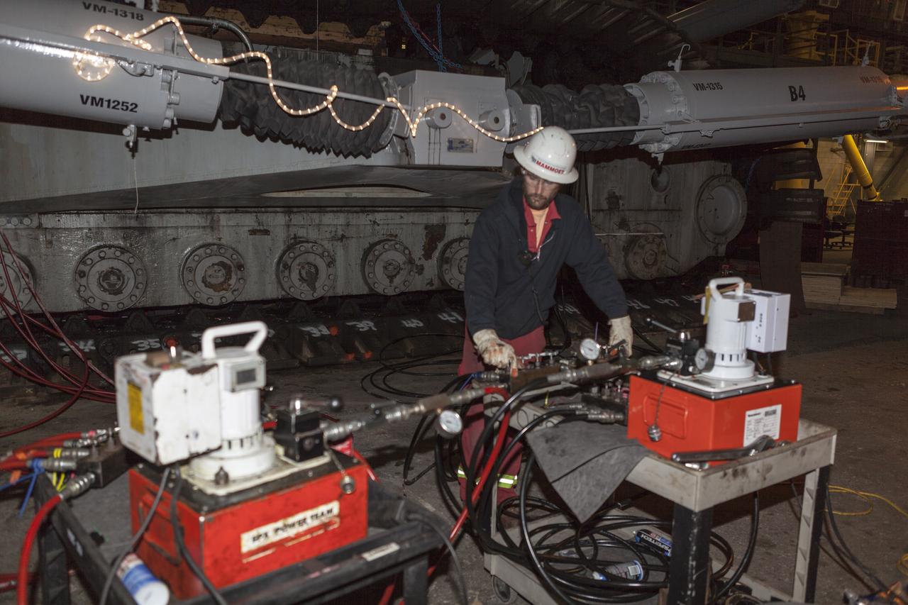 CAPE CANAVERAL, Fla. – Inside the Vehicle Assembly Building at NASA’s Kennedy Space Center in Florida, the B and D truck sections of crawler-transporter 2, or CT-2, are being raised up to prepare for installation of new roller bearing assemblies. Work continues in high bay 2 to upgrade CT-2. The modifications are designed to ensure CT-2’s ability to transport launch vehicles currently in development, such as the agency’s Space Launch System, to the launch pad. The Ground Systems Development and Operations Program office at Kennedy is overseeing the upgrades. For more than 45 years the crawler-transporters were used to transport the mobile launcher platform and the Apollo-Saturn V rockets and, later, space shuttles to Launch Pads 39A and B. For more information, visit: http://www.nasa.gov/exploration/systems/ground/crawler-transporter. Photo credit: NASA/Dimitri Gerondidakis