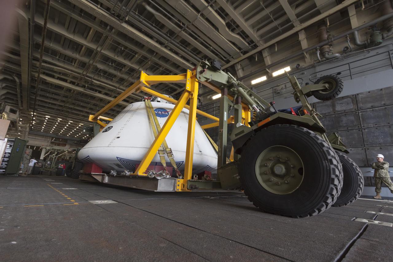 SAN DIEGO, Calif. – The Orion boilerplate test vehicle arrived at the U.S. Naval Base San Diego in California, and was loaded aboard the USS San Diego. Orion was transported in the ship’s well deck about 100 miles offshore for an underway recovery test. NASA and the U.S. Navy are conducting tests to prepare for recovery of the Orion crew module, forward bay cover and parachutes on its return from a deep space mission. The underway recovery test will allow the teams to demonstrate and evaluate the recovery processes, procedures, hardware and personnel in open waters. The Ground Systems Development and Operations Program Orion is the exploration spacecraft designed to carry astronauts to destinations not yet explored by humans, including an asteroid and Mars. It will have emergency abort capability, sustain the crew during space travel and provide safe re-entry from deep space return velocities. The first unpiloted test flight of the Orion is scheduled to launch in 2014 atop a Delta IV rocket and in 2017 on NASA’s Space Launch System rocket. For more information, visit http://www.nasa.gov/orion. Photo credit: NASA/Cory Huston  