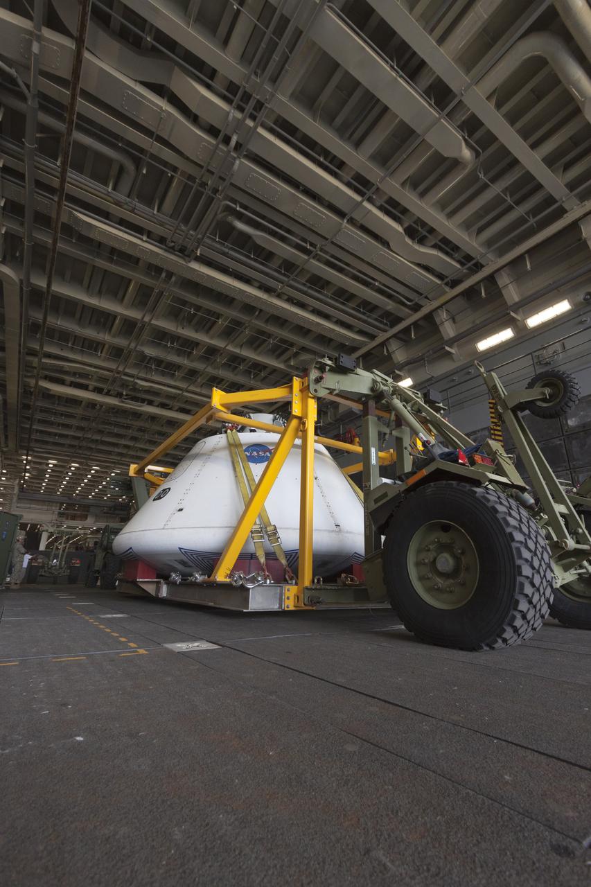 SAN DIEGO, Calif. – The Orion boilerplate test vehicle arrived at the U.S. Naval Base San Diego in California, and is loaded aboard the USS San Diego. Orion was transported in the ship’s well deck about 100 miles offshore for an underway recovery test. NASA and the U.S. Navy are conducting tests to prepare for recovery of the Orion crew module, forward bay cover and parachutes on its return from a deep space mission. The underway recovery test will allow the teams to demonstrate and evaluate the recovery processes, procedures, hardware and personnel in open waters. The Ground Systems Development and Operations Program Orion is the exploration spacecraft designed to carry astronauts to destinations not yet explored by humans, including an asteroid and Mars. It will have emergency abort capability, sustain the crew during space travel and provide safe re-entry from deep space return velocities. The first unpiloted test flight of the Orion is scheduled to launch in 2014 atop a Delta IV rocket and in 2017 on NASA’s Space Launch System rocket. For more information, visit http://www.nasa.gov/orion. Photo credit: NASA/Cory Huston