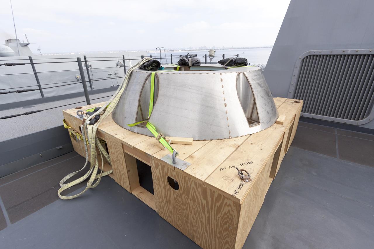 SAN DIEGO, Calif. – At the U.S. Naval Base San Diego in California, the USS San Diego heads out to sea with the Orion boilerplate test vehicle and other hardware in its well deck for an underway recovery test. On the top deck is the Orion forward bay cover. About 100 miles offshore, NASA and the U.S. Navy conducted tests to prepare for recovery of the Orion crew module, forward bay cover and parachutes on its return from a deep space mission. The underway recovery test will allow the teams to demonstrate and evaluate the recovery processes, procedures, hardware and personnel in open waters. During the testing, the tether lines were unable to support the tension caused by crew module motion that was driven by wave turbulence in the well deck of the ship. NASA and the U.S. Navy are reviewing the testing data collected to evaluate the next steps. The Ground Systems Development and Operations Program conducted the underway recovery tests. Orion is the exploration spacecraft designed to carry astronauts to destinations not yet explored by humans, including an asteroid and Mars. It will have emergency abort capability, sustain the crew during space travel and provide safe re-entry from deep space return velocities. The first unpiloted test flight of the Orion is scheduled to launch in 2014 atop a Delta IV rocket and in 2017 on NASA’s Space Launch System rocket. For more information, visit http://www.nasa.gov/orion. Photo credit: NASA/Cory Huston  