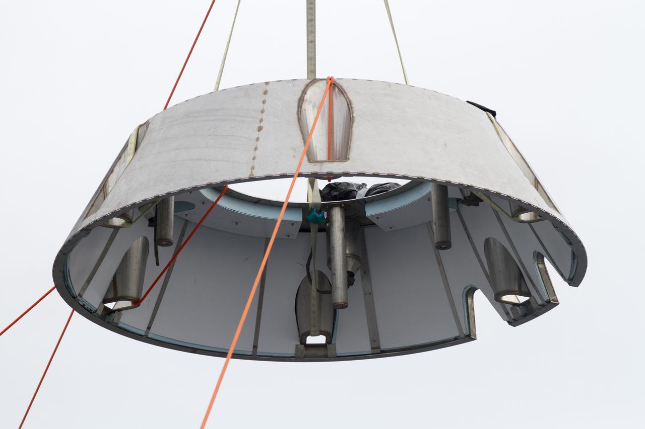 SAN DIEGO, Calif. – The Orion forward bay cover is lowered into the water using a crane and tether lines as part of the Orion underway recovery test. The Orion boilerplate test vehicle and other hardware are secured in the well deck of the USS San Diego in preparation for the test about 100 miles off the coast of San Diego, California. NASA and the U.S. Navy conducted tests to prepare for the recovery of the Orion crew module, forward bay cover and parachutes on its return from a deep space mission. The underway recovery test will allow the teams to demonstrate and evaluate the recovery processes, procedures, hardware and personnel in open waters. During the testing, the tether lines were unable to support the tension caused by crew module motion that was driven by wave turbulence in the well deck of the ship. NASA and the U.S. Navy are reviewing the testing data collected to evaluate the next steps. The Ground Systems Development and Operations Program conducted the underway recovery tests. Orion is the exploration spacecraft designed to carry astronauts to destinations not yet explored by humans, including an asteroid and Mars. It will have emergency abort capability, sustain the crew during space travel and provide safe re-entry from deep space return velocities. The first unpiloted test flight of the Orion is scheduled to launch in 2014 atop a Delta IV rocket and in 2017 on NASA’s Space Launch System rocket. For more information, visit http://www.nasa.gov/orion. Photo credit: NASA/Cory Huston