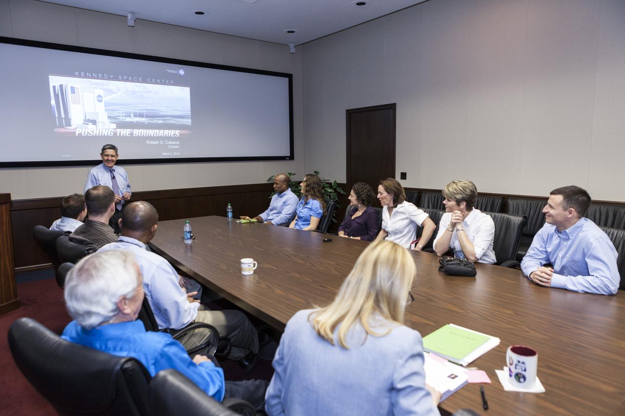 CAPE CANAVERAL, Fla. -- Kennedy Space Center Director Bob Cabana briefs members of the most recently selected group of NASA astronauts. The presentation covering operations at the Florida spaceport took place in the center's Headquarters Building. The astronaut class of 2013 was selected by NASA after an extensive year-and-a-half search. The new group will help the agency push the boundaries of exploration and travel to new destinations in the solar system. To learn more about the astronaut class of 2013, visit: http://www.nasa.gov/astronauts/2013astroclass.html Photo credit: NASA/Kim Shiflett
