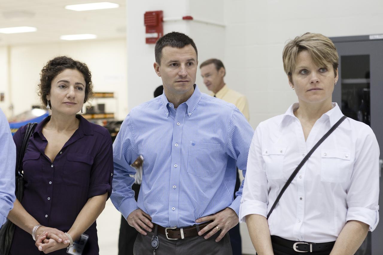 CAPE CANAVERAL, Fla. -- In the Operations and Checkout Building of NASA's Kennedy Space Center in Florida, astronaut candidates Jessica Meir, left, Andrew Morgan, center, and Anne McClain listen to a briefing on preparations for the launch the Orion spacecraft on Exploration Flight Test EFT-1. Plans call for the Lockheed Martin-built Orion to launch atop a United Launch Alliance Delta IV Heavy rocket from Cape Canaveral Air Force Station. The astronaut class of 2013 was selected by NASA after an extensive year-and-a-half search. The new group will help the agency push the boundaries of exploration and travel to new destinations in the solar system. To learn more about the astronaut class of 2013, visit: http://www.nasa.gov/astronauts/2013astroclass.html Photo credit: NASA/Kim Shiflett