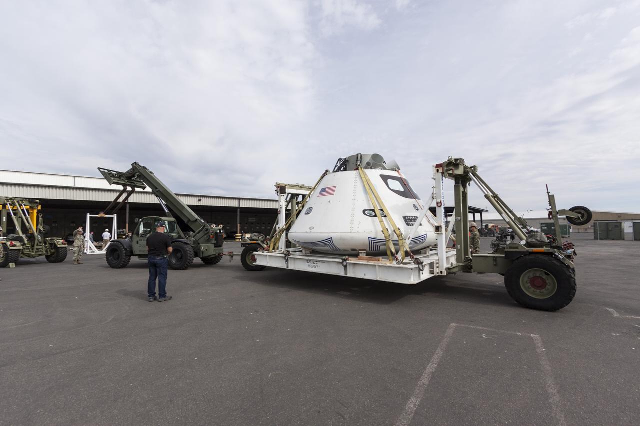 SAN DIEGO, Calif. – The Orion boilerplate test vehicle was offloaded from the USS San Diego at the U.S. Naval Base San Diego in California. Orion was transported in the ship’s well deck about 100 miles offshore for an underway recovery test. NASA and the U.S. Navy conducted tests to prepare for recovery of the Orion crew module, forward bay cover and parachutes on its return from a deep space mission. The underway recovery test allowed the teams to demonstrate and evaluate the recovery processes, procedures, hardware and personnel in open waters. During the testing, the tether lines were unable to support the tension caused by crew module motion that was driven by wave turbulence in the well deck of the ship. NASA and the U.S. Navy are reviewing the testing data collected to evaluate the next steps. The Ground Systems Development and Operations Program was conducting the recovery tests. Orion is the exploration spacecraft designed to carry astronauts to destinations not yet explored by humans, including an asteroid and Mars. It will have emergency abort capability, sustain the crew during space travel and provide safe re-entry from deep space return velocities. The first unpiloted test flight of the Orion is scheduled to launch in 2014 atop a Delta IV rocket and in 2017 on NASA’s Space Launch System rocket. For more information, visit http://www.nasa.gov/orion. Photo credit: NASA/Cory Huston  