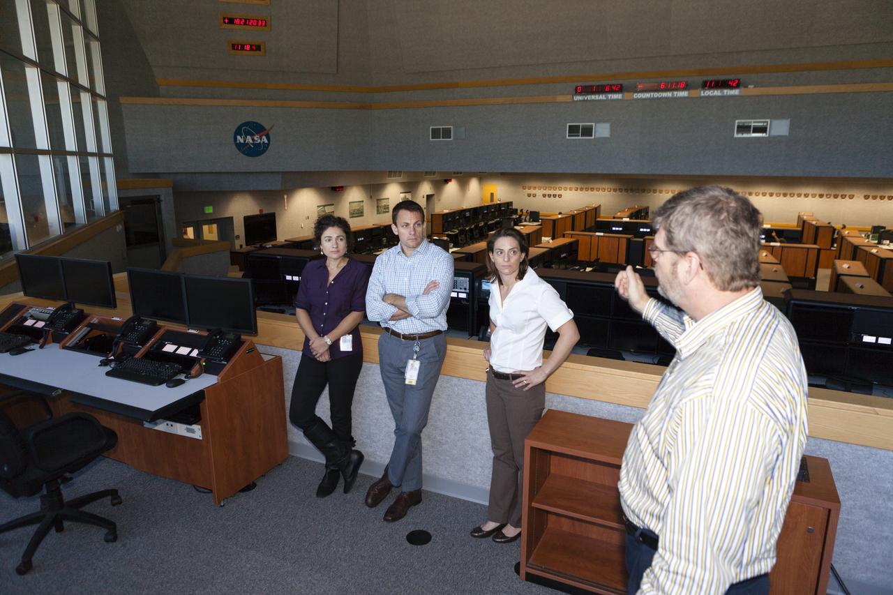 CAPE CANAVERAL, Fla. – NASA astronaut candidates Andrew Morgan, from left, Nicole Mann, Tyler Nick Hague, Josh Cassada, Anne McClain, Christina Hammock and Victor Glover listen to a discussion about firing rooms inside the Launch Control Center at Kennedy Space Center in Florida during a daylong set of briefings and tours of different facilities at NASA's primary launch center. The astronaut class of 2013 was selected by NASA after an extensive year-and-a-half search. The new group will help the agency push the boundaries of exploration and travel to new destinations in the solar system. To learn more about the astronaut class of 2013, visit: http://www.nasa.gov/astronauts/2013astroclass.html Photo credit: NASA/Kim Shiflett