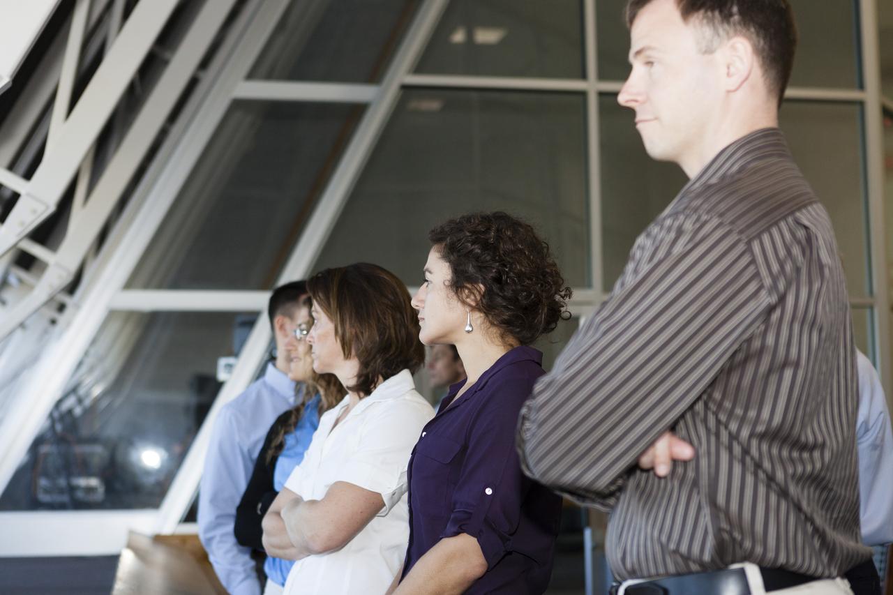 CAPE CANAVERAL, Fla. – NASA astronaut candidates Jessica Meir, Tyler Nick Hague and Nicole Mann listen to a discussion about firing rooms inside the Launch Control Center at Kennedy Space Center in Florida during a daylong set of briefings and tours of different facilities at NASA's primary launch center. The astronaut class of 2013 was selected by NASA after an extensive year-and-a-half search. The new group will help the agency push the boundaries of exploration and travel to new destinations in the solar system. To learn more about the astronaut class of 2013, visit: http://www.nasa.gov/astronauts/2013astroclass.html Photo credit: NASA/Kim Shiflett