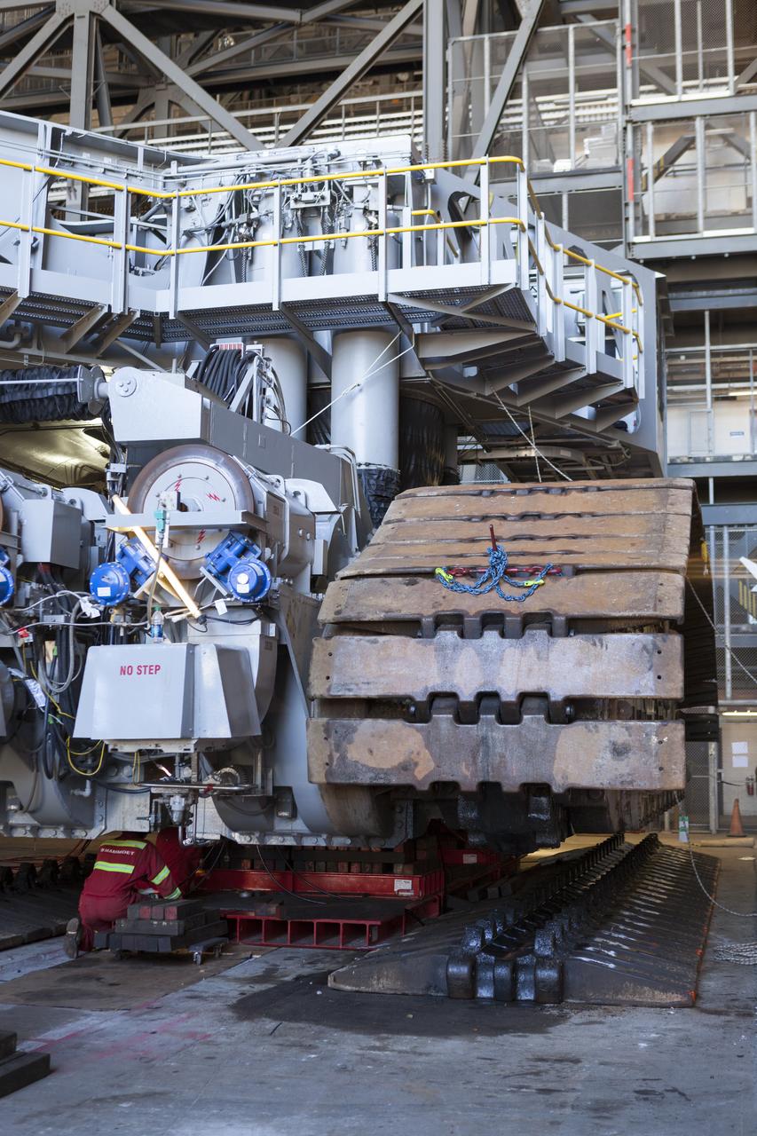 CAPE CANAVERAL, Fla. – Inside the Vehicle Assembly Building at NASA’s Kennedy Space Center in Florida, the B and D truck sections of crawler-transporter 2, or CT-2, are being raised up to prepare for installation of new roller bearing assemblies. Sections of the crawler’s large metal tracks have been removed. Work continues in high bay 2 to upgrade CT-2. The modifications are designed to ensure CT-2’s ability to transport launch vehicles currently in development, such as the agency’s Space Launch System, to the launch pad. The Ground Systems Development and Operations Program office at Kennedy is overseeing the upgrades. For more than 45 years the crawler-transporters were used to transport the mobile launcher platform and the Apollo-Saturn V rockets and, later, space shuttles to Launch Pads 39A and B. For more information, visit: http://www.nasa.gov/exploration/systems/ground/crawler-transporter. Photo credit: NASA/Dimitri Gerondidakis