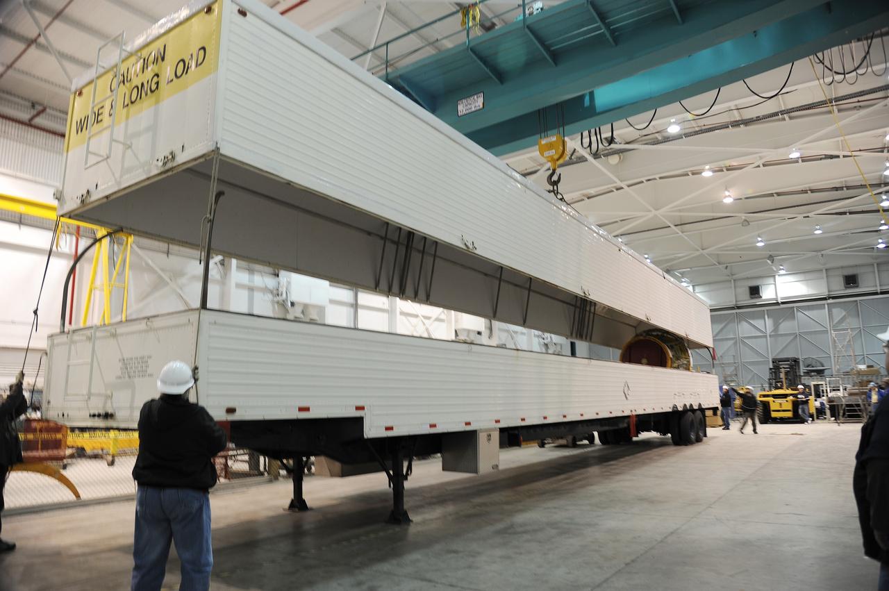 VANDENBERG AIR FORCE BASE, Calif. – As the cover of the transportation trailer is lifted in the high bay of the Building 836 hangar on Vandenberg Air Force Base in California, the second stage for NASA's Orbiting Carbon Observatory-2 mission, or OCO-2, comes into view.    OCO-2 is scheduled to launch aboard a United Launch Alliance Delta II rocket from Space Launch Complex 2 in July. The rocket's second stage will insert OCO-2 into a polar Earth orbit.  OCO-2 will collect precise global measurements of carbon dioxide in the Earth's atmosphere and provide scientists with a better idea of the chemical compound's impacts on climate change. Scientists will analyze this data to improve our understanding of the natural processes and human activities that regulate the abundance and distribution of this important atmospheric gas. To learn more about OCO-2, visit http://oco.jpl.nasa.gov.  Photo credit: NASA/Arron Tauman, 30th Space Wing, VAFB