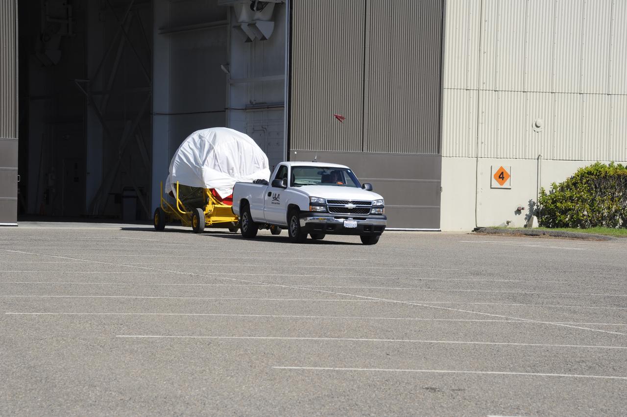 VANDENBERG AIR FORCE BASE, Calif. – The second stage for NASA's Orbiting Carbon Observatory-2 mission, or OCO-2, is being towed from the Building 836 hangar to the Horizontal Processing Facility at Space Launch Complex 2 on Vandenberg Air Force Base in California. OCO-2 is scheduled to launch aboard a United Launch Alliance Delta II rocket in July. The rocket's second stage will insert OCO-2 into a polar Earth orbit. OCO-2 will collect precise global measurements of carbon dioxide in the Earth's atmosphere and provide scientists with a better idea of the chemical compound's impacts on climate change. Scientists will analyze this data to improve our understanding of the natural processes and human activities that regulate the abundance and distribution of this important atmospheric gas. To learn more about OCO-2, visit http://oco.jpl.nasa.gov. Photo credit: NASA/Arron Tauman, 30th Space Wing, VAFB