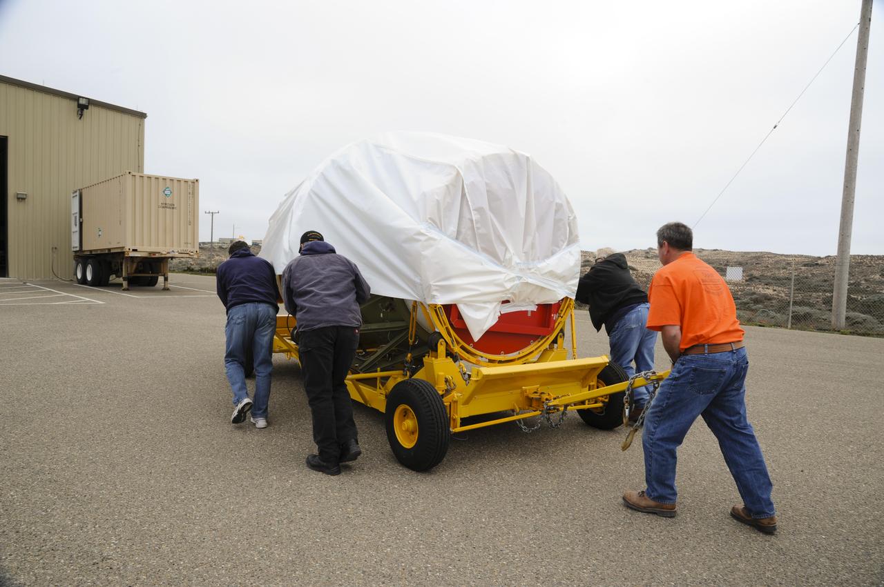 VANDENBERG AIR FORCE BASE, Calif. – Workers push the second stage for NASA's Orbiting Carbon Observatory-2 mission, or OCO-2, toward the Horizontal Processing Facility at Space Launch Complex 2 on Vandenberg Air Force Base in California. OCO-2 is scheduled to launch aboard a United Launch Alliance Delta II rocket in July. The rocket's second stage will insert OCO-2 into a polar Earth orbit. OCO-2 will collect precise global measurements of carbon dioxide in the Earth's atmosphere and provide scientists with a better idea of the chemical compound's impacts on climate change. Scientists will analyze this data to improve our understanding of the natural processes and human activities that regulate the abundance and distribution of this important atmospheric gas. To learn more about OCO-2, visit http://oco.jpl.nasa.gov. Photo credit: NASA/Arron Tauman, 30th Space Wing, VAFB