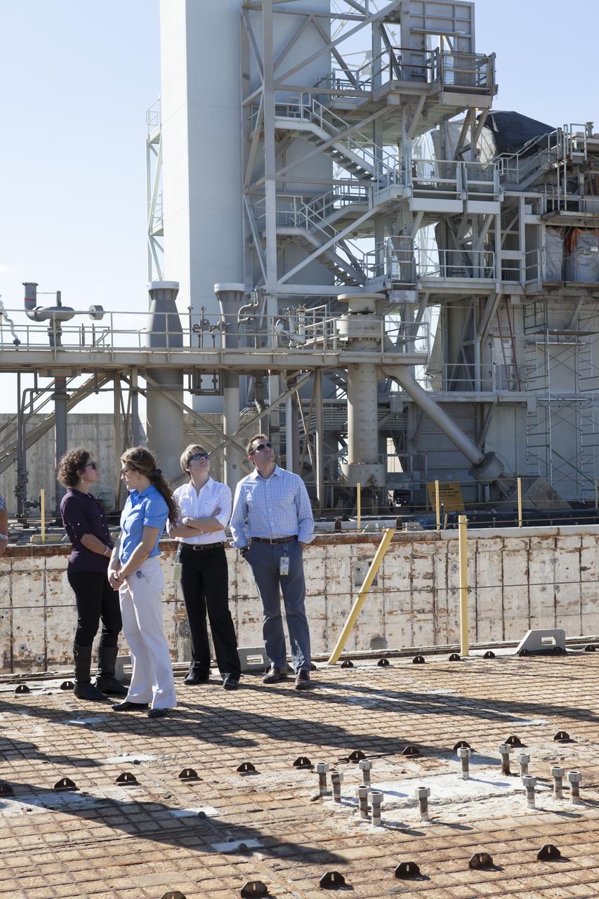 CAPE CANAVERAL, Fla. – NASA astronaut candidates Jessica Meir, Christina Hammock, Anne McClain and Josh Cassada listen to details about Launch Complex 39B at NASA's Kennedy Space Center during a daylong set of briefings and tours of different facilities at NASA's primary launch center. The astronaut class of 2013 was selected by NASA after an extensive year-and-a-half search. The new group will help the agency push the boundaries of exploration and travel to new destinations in the solar system. To learn more about the astronaut class of 2013, visit: http://www.nasa.gov/astronauts/2013astroclass.html Photo credit: NASA/Kim Shiflett