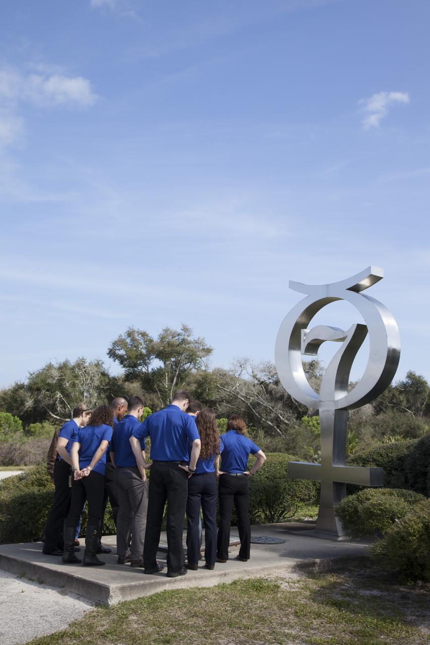 CAPE CANAVERAL, Fla. – NASA astronaut candidates Anne McClain, from left, Jessica Meir, Victor Glover, Andrew Morgan, Tyler "Nick" Hague, Josh Cassada, Christina Hammock and Nicole Mann visit the Mercury 7 memorial at Cape Canaveral Air Force Station in Florida, adjacent to NASA's Kennedy Space Center. The astronaut class of 2013 was selected by NASA after an extensive year-and-a-half search. The new group will help the agency push the boundaries of exploration and travel to new destinations in the solar system. To learn more about the astronaut class of 2013, visit: http://www.nasa.gov/astronauts/2013astroclass.html Photo credit: NASA/Frankie Martin
