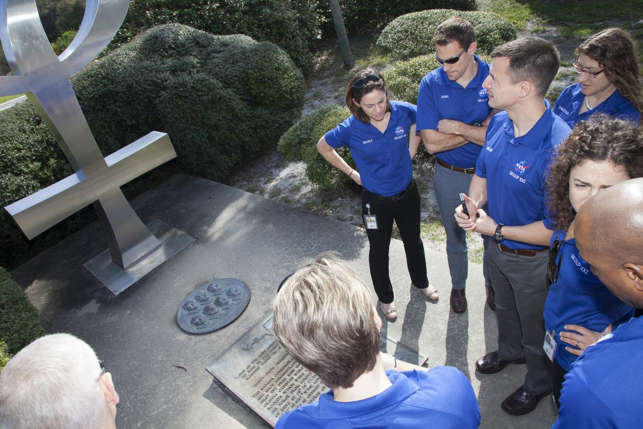 CAPE CANAVERAL, Fla. – NASA astronaut candidates Anne McClain, from left counterclockwise, Victor Glover, Jessica Meir, Andrew Morgan, Christina Hammock, Josh Cassada and Nicole Mann visit the Mercury 7 memorial at Cape Canaveral Air Force Station in Florida, adjacent to NASA's Kennedy Space Center. The astronaut class of 2013 was selected by NASA after an extensive year-and-a-half search. The new group will help the agency push the boundaries of exploration and travel to new destinations in the solar system. To learn more about the astronaut class of 2013, visit: http://www.nasa.gov/astronauts/2013astroclass.html Photo credit: NASA/Frankie Martin