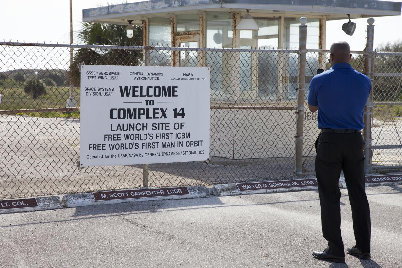 CAPE CANAVERAL, Fla. – NASA astronaut candidate Victor Glover reviews a sign at the entrance to Complex 14 at Cape Canaveral Air Force Station in Florida, adjacent to NASA's Kennedy Space Center. Complex 14 served as the launch pad for Mercury astronaut John Glenn when he lifted off in 1962 to orbit the Earth, becoming the first American to do so. The astronaut class of 2013 was selected by NASA after an extensive year-and-a-half search. The new group will help the agency push the boundaries of exploration and travel to new destinations in the solar system. To learn more about the astronaut class of 2013, visit: http://www.nasa.gov/astronauts/2013astroclass.html Photo credit: NASA/Frankie Martin