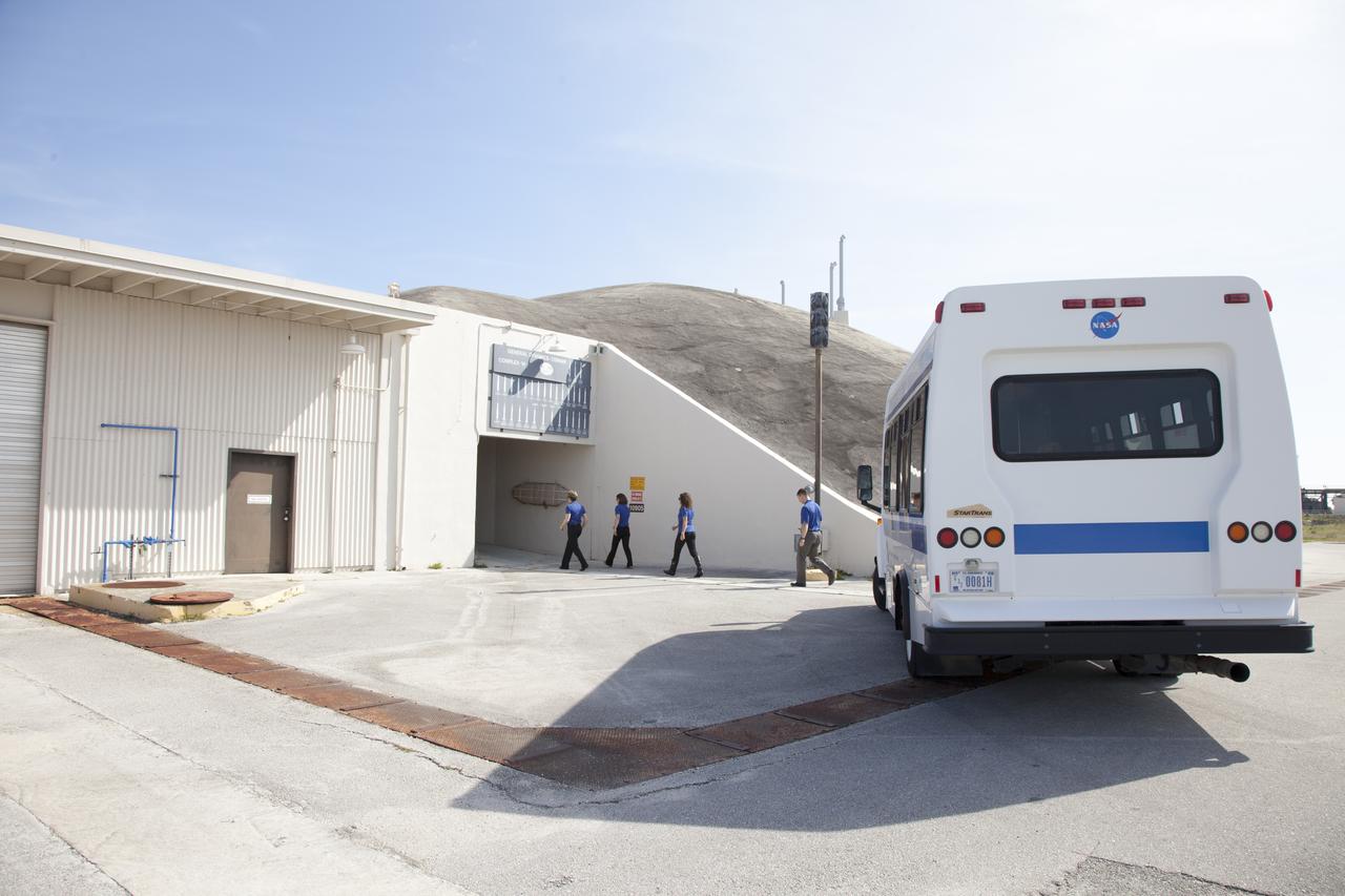 CAPE CANAVERAL, Fla. – NASA astronaut candidates enter the blockhouse at Complex 14 at Cape Canaveral Air Force Station in Florida, adjacent to NASA's Kennedy Space Center. Complex 14 served as the launch pad for Mercury astronaut John Glenn when he lifted off in 1962 to orbit the Earth, becoming the first American to do so. The astronaut class of 2013 was selected by NASA after an extensive year-and-a-half search. The new group will help the agency push the boundaries of exploration and travel to new destinations in the solar system. To learn more about the astronaut class of 2013, visit: http://www.nasa.gov/astronauts/2013astroclass.html Photo credit: NASA/Frankie Martin