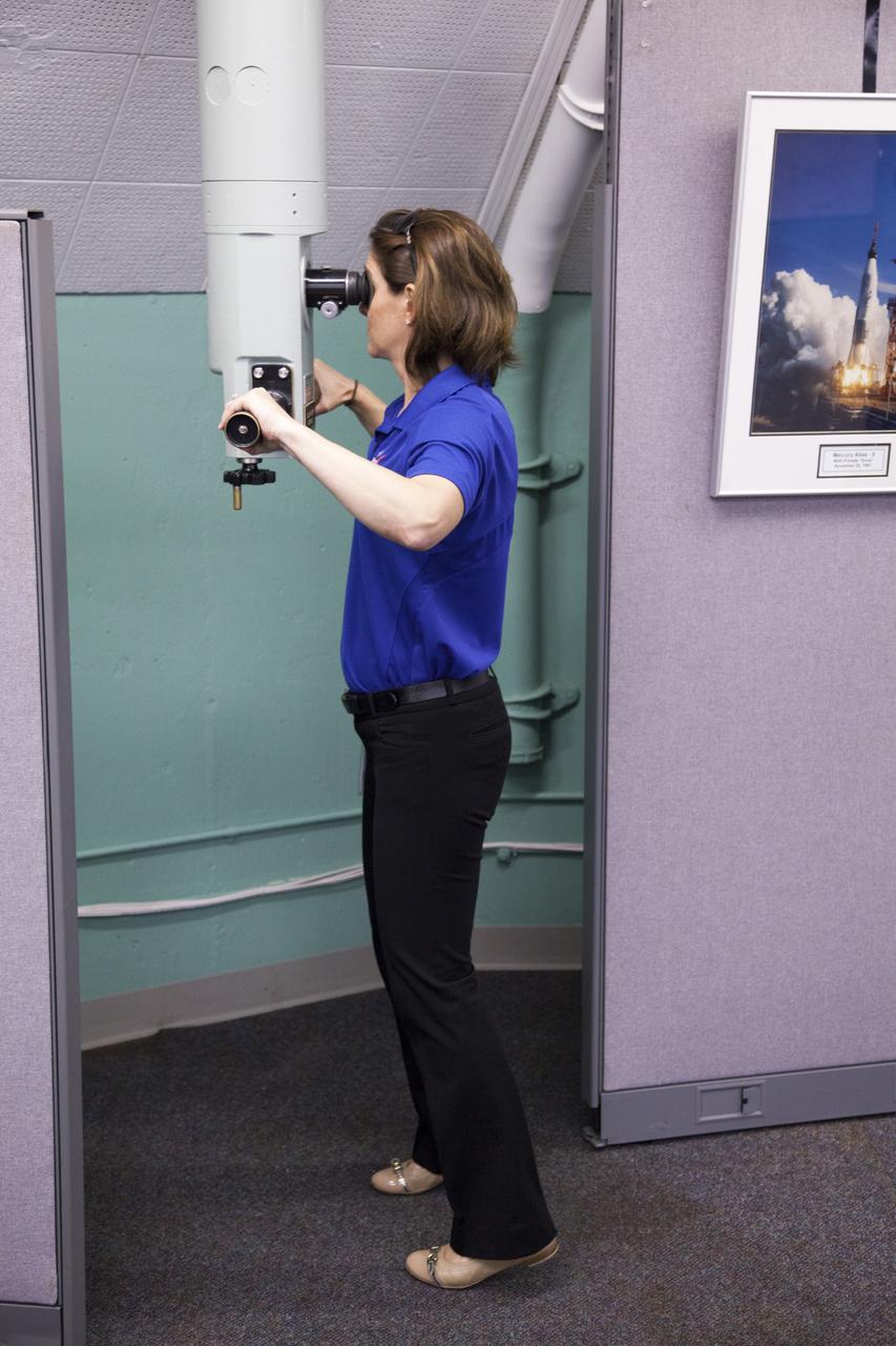 CAPE CANAVERAL, Fla. – NASA astronaut candidate Nicole Mann uses a periscope inside the blockhouse at Complex 14 at Cape Canaveral Air Force Station in Florida, adjacent to NASA's Kennedy Space Center. Complex 14 served as the launch pad for Mercury astronaut John Glenn when he lifted off in 1962 to orbit the Earth, becoming the first American to do so. The astronaut class of 2013 was selected by NASA after an extensive year-and-a-half search. The new group will help the agency push the boundaries of exploration and travel to new destinations in the solar system. To learn more about the astronaut class of 2013, visit: http://www.nasa.gov/astronauts/2013astroclass.html Photo credit: NASA/Frankie Martin