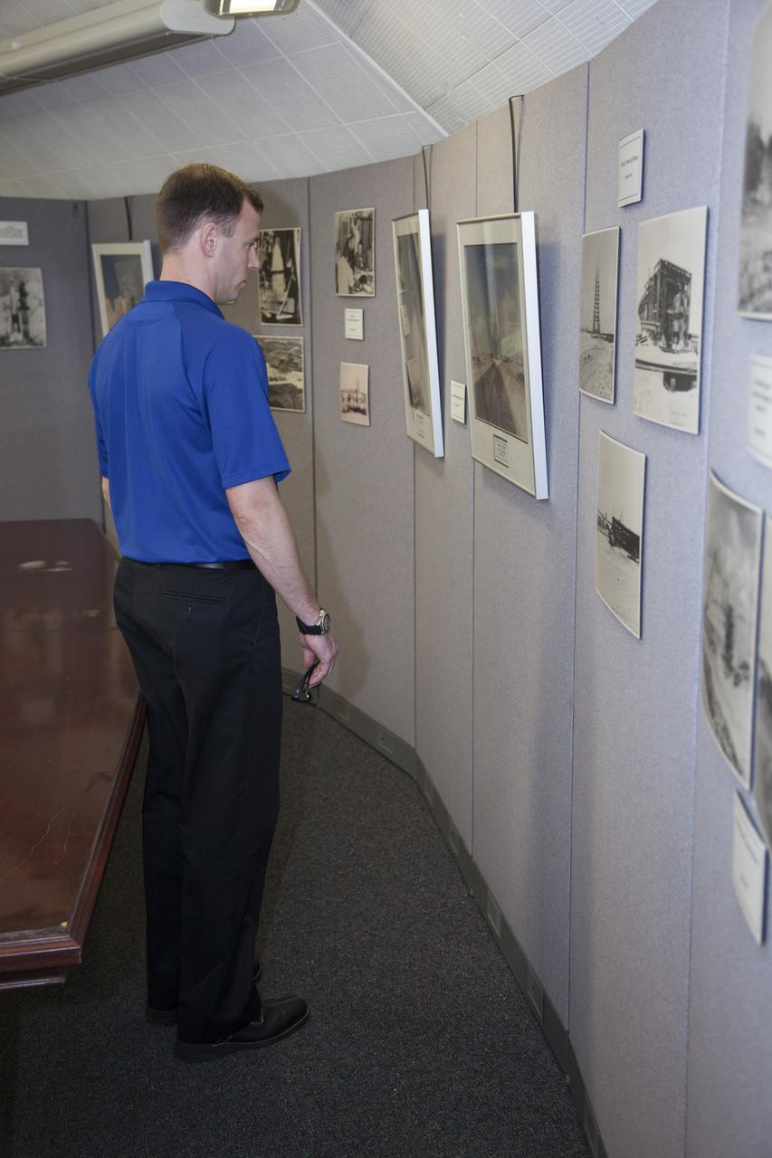 CAPE CANAVERAL, Fla. – NASA astronaut candidate Tyler "Nick" Hague looks over photos inside the blockhouse at Complex 14 at Cape Canaveral Air Force Station in Florida, adjacent to NASA's Kennedy Space Center. Complex 14 served as the launch pad for Mercury astronaut John Glenn when he lifted off in 1962 to orbit the Earth, becoming the first American to do so. The astronaut class of 2013 was selected by NASA after an extensive year-and-a-half search. The new group will help the agency push the boundaries of exploration and travel to new destinations in the solar system. To learn more about the astronaut class of 2013, visit: http://www.nasa.gov/astronauts/2013astroclass.html Photo credit: NASA/Frankie Martin