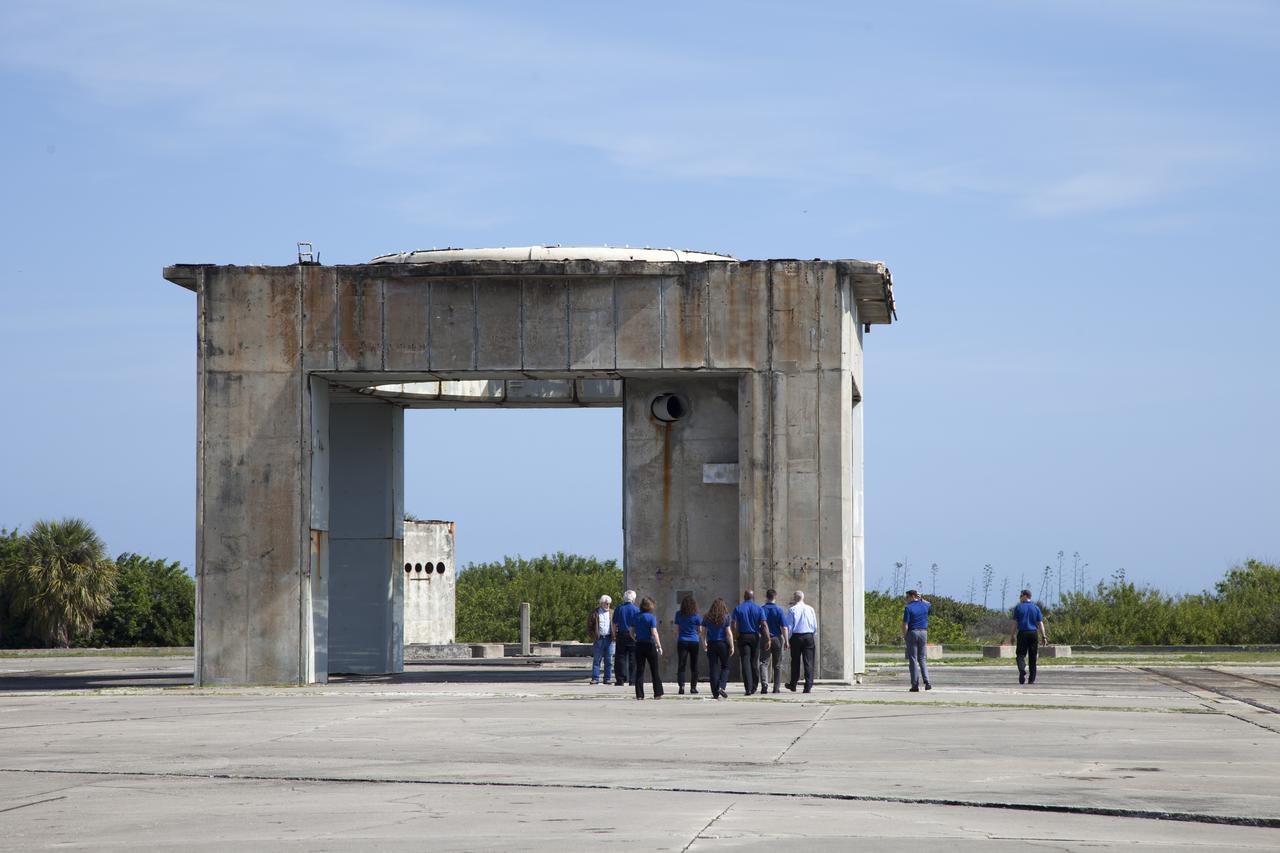 CAPE CANAVERAL, Fla. – NASA astronaut candidates survey Launch Complex 34 at Cape Canaveral Air Force Station in Florida, adjacent to NASA's Kennedy Space Center. Complex 34 was the sight of NASA's first astronaut fatalities when the crew of Apollo 1, Gus Grissom, Ed White and Roger Chaffee, died in a fire inside their Apollo capsule during testing at the pad. The astronaut class of 2013 was selected by NASA after an extensive year-and-a-half search. The new group will help the agency push the boundaries of exploration and travel to new destinations in the solar system. To learn more about the astronaut class of 2013, visit: http://www.nasa.gov/astronauts/2013astroclass.html Photo credit: NASA/Frankie Martin