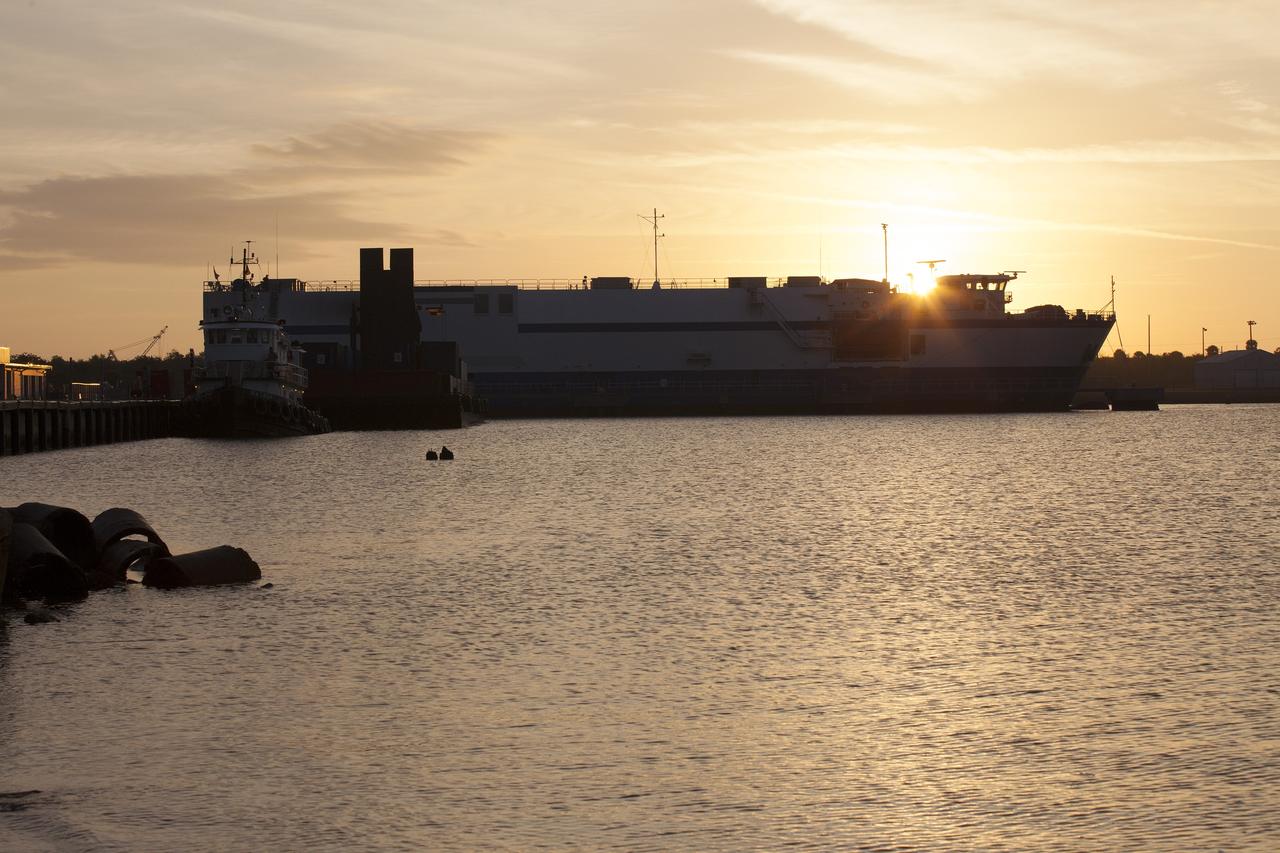 CAPE CANAVERAL, Fla. – A barge arrives at the U.S. Army Outpost wharf at Port Canaveral in Florida, carrying two of the three United Launch Alliance Delta IV heavy boosters for NASA’s upcoming Exploration Flight Test-1, or EFT-1, mission with the Orion spacecraft. The core booster and starboard booster will be offloaded and then transported to the Horizontal Integration Facility, or HIF, at Space Launch Complex 37 on Cape Canaveral Air Force Station. The port booster and the upper stage are planned to be shipped to Cape Canaveral in April.    At the HIF, all three boosters will be processed and checked out before being moved to the nearby launch pad and hoisted into position. During the EFT-1 mission, Orion will travel farther into space than any human spacecraft has gone in more than 40 years.  The data gathered during the flight will influence design decisions, validate existing computer models and innovative new approaches to space systems development, as well as reduce overall mission risks and costs for later Orion flights. Liftoff of Orion on EFT-1 is planned for fall 2014. Photo credit: NASA/Kim Shiflett