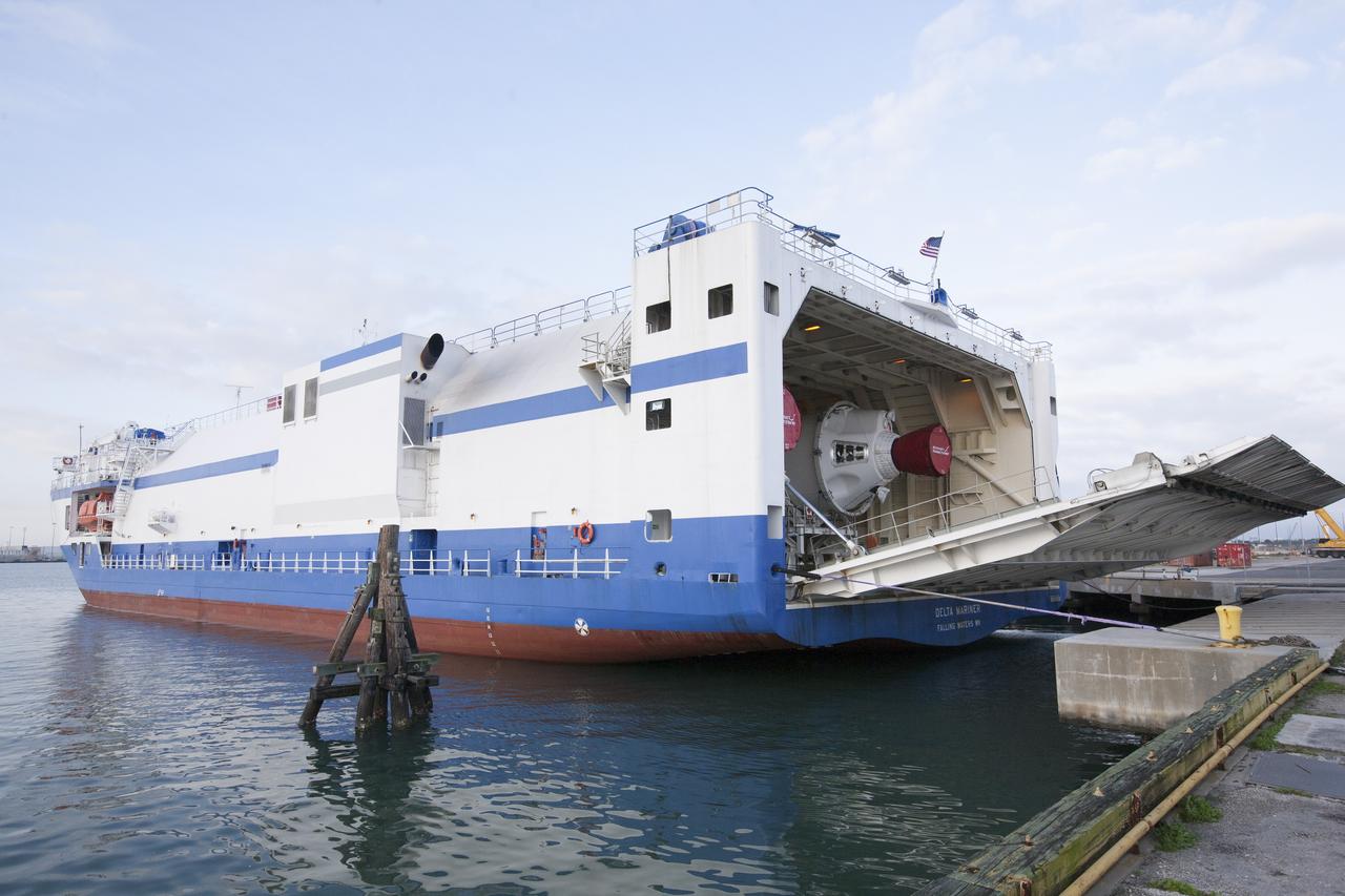 CAPE CANAVERAL, Fla. – A barge arrives at the U.S. Army Outpost wharf at Port Canaveral in Florida, carrying two of the three United Launch Alliance Delta IV heavy boosters for NASA’s upcoming Exploration Flight Test-1, or EFT-1, mission with the Orion spacecraft. The core booster and starboard booster will be offloaded and then transported to the Horizontal Integration Facility, or HIF, at Space Launch Complex 37 on Cape Canaveral Air Force Station. The port booster and the upper stage are planned to be shipped to Cape Canaveral in April. At the HIF, all three boosters will be processed and checked out before being moved to the nearby launch pad and hoisted into position. During the EFT-1 mission, Orion will travel farther into space than any human spacecraft has gone in more than 40 years. The data gathered during the flight will influence design decisions, validate existing computer models and innovative new approaches to space systems development, as well as reduce overall mission risks and costs for later Orion flights. Liftoff of Orion on EFT-1 is planned for fall 2014. Photo credit: NASA/Kim Shiflett